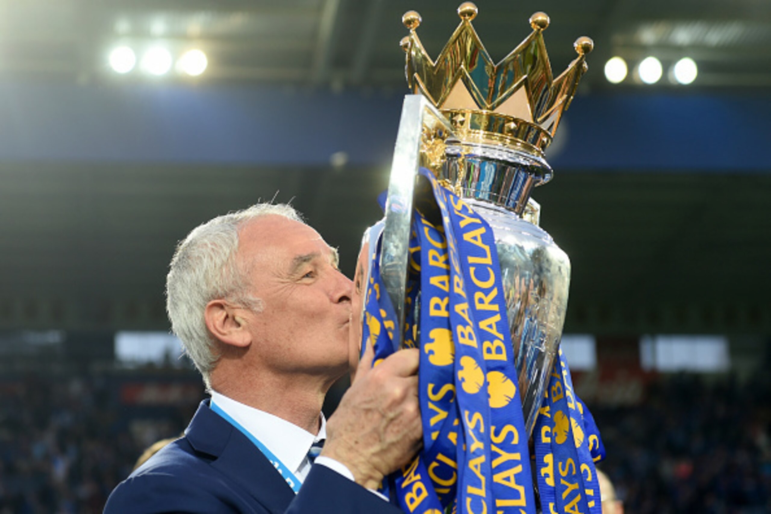 LEICESTER, ENGLAND - MAY 07:  Claudio Ranieri Manager of Leicester City kisses the Premier League Trophy after the Barclays Premier League match between Leicester City and Everton at The King Power Stadium on May 7, 2016 in Leicester, United Kingdom.  (Ph