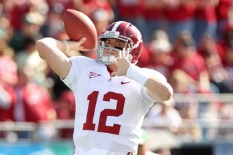 ORLANDO, FL - JANUARY 01:  Greg McElroy #12 of the Alabama Crimson Tide warms up during the Capitol One Bowl against the Michigan State Spartans at the Florida Citrus Bowl on January 1, 2011 in Orlando, Florida.  (Photo by Mike Ehrmann/Getty Images)