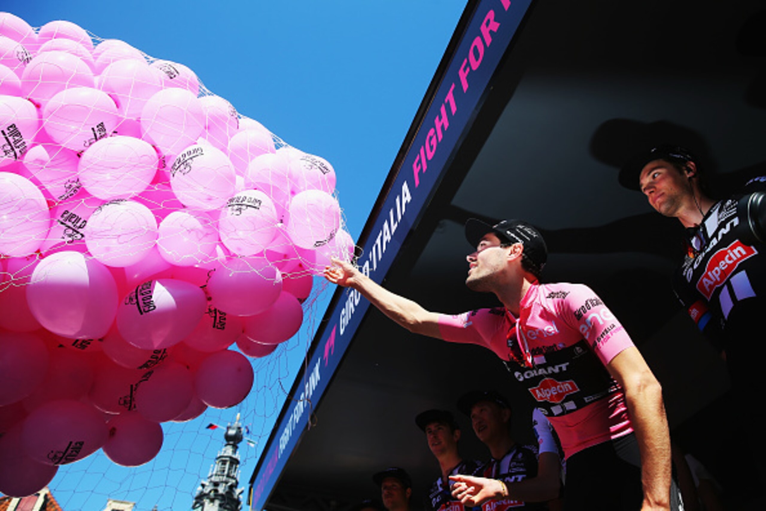 NIJMEGEN, NETHERLANDS - MAY 08:  Race leader Tom Dumoulin of The Netherlands and Team Giant Alpecin releases some pink balloons into the sky at the start of stage three of the 2016 Giro d'Italia, after a 190km stage from Nijmegen to Arnhem on May 8, 2016 