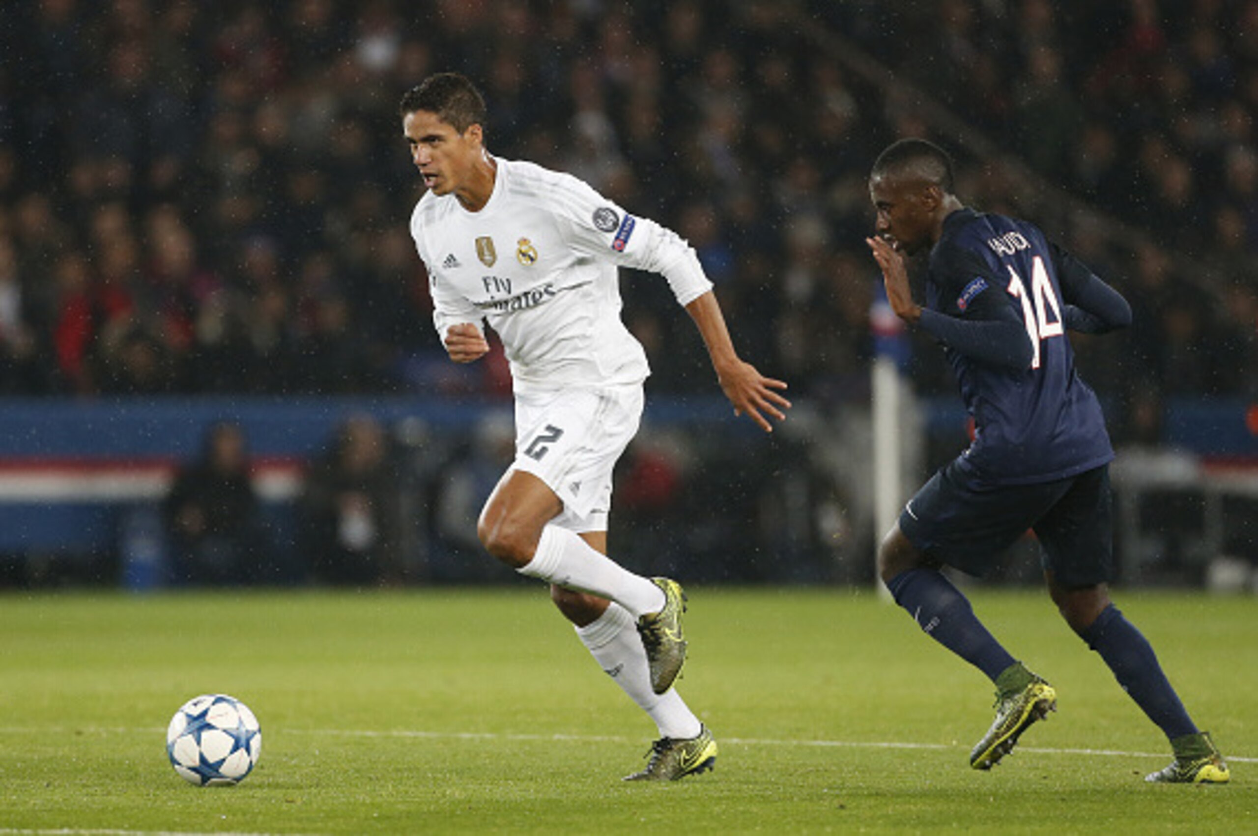 PARIS, FRANCE - OCTOBER 21: Raphael Varane of Real Madrid and Blaise Matuidi of PSG in action during the UEFA Champions League match between Paris Saint-Germain (PSG) and Real Madrid at Parc des Princes stadium on October 21, 2015 in Paris, France. (Photo