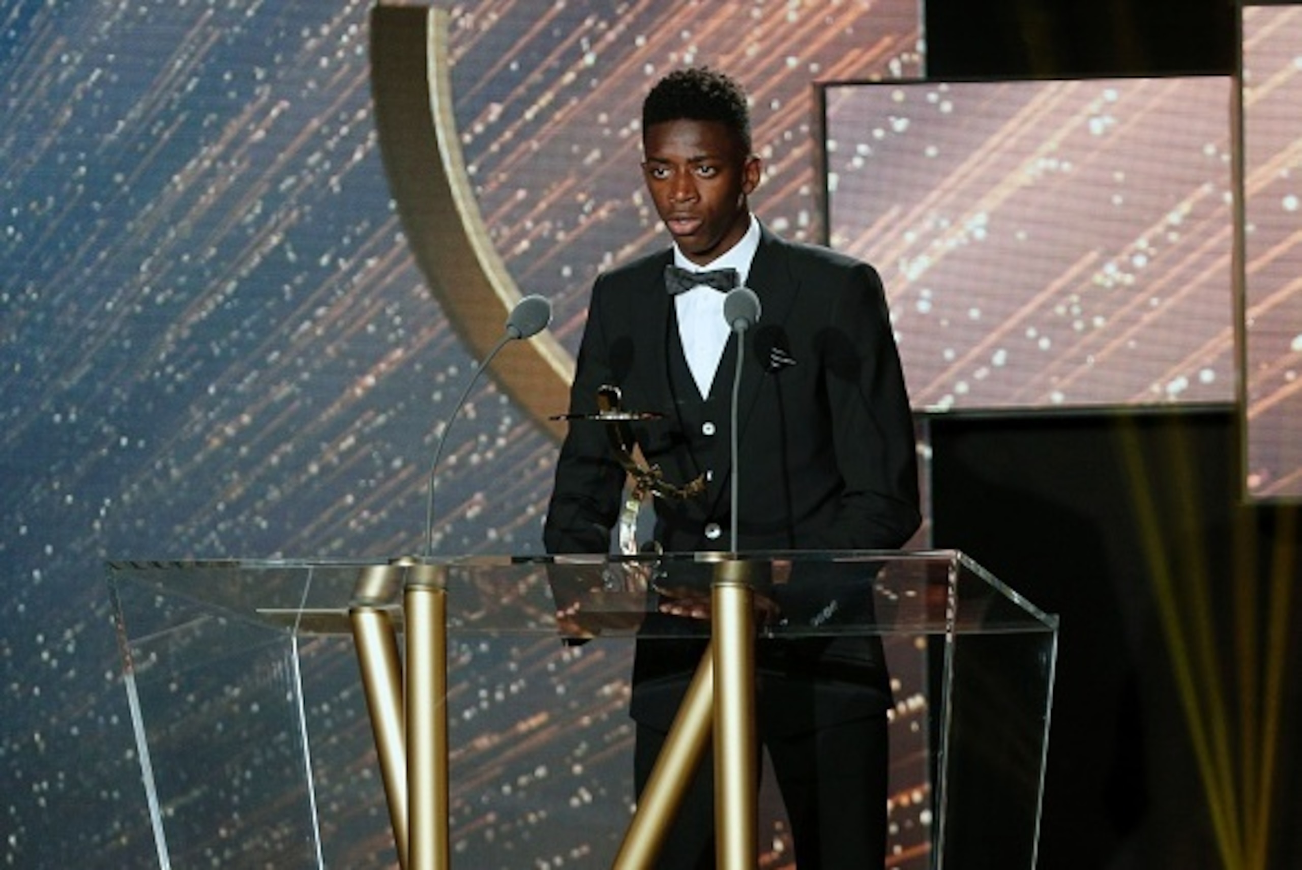 French Rennes' forward Ousmane Dembele receives the Ligue 1 2015-2016 young player of the year award during the 25th professionnal football players national union's (Union Nationale des Footballeurs professionnels, UNFP) trophies cemenony in Paris on May 