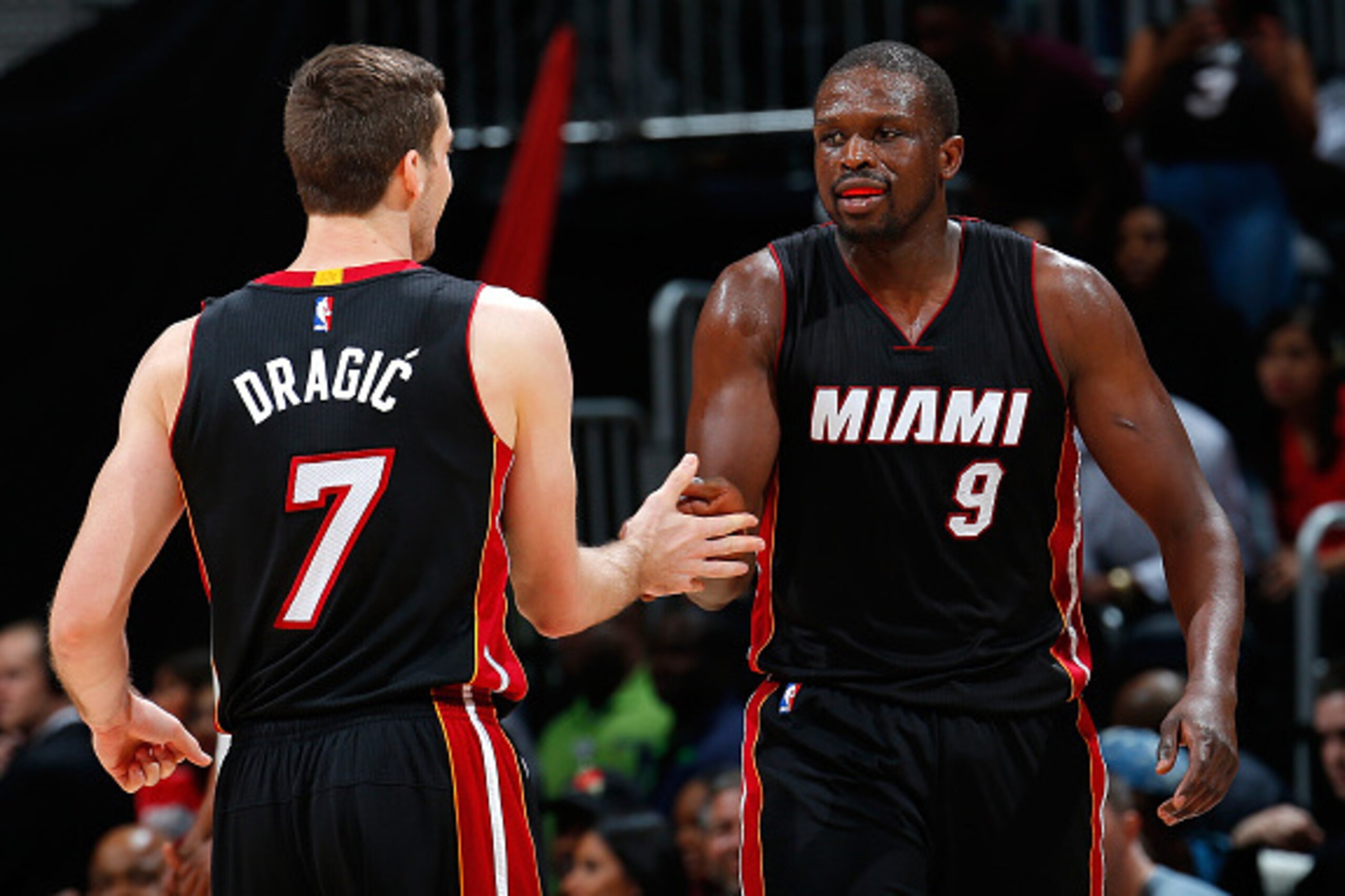 ATLANTA, GA - FEBRUARY 19: Luol Deng #9 of the Miami Heat reacts after hitting a three-point basket against the Atlanta Hawks with Goran Dragic #7 at Philips Arena on February 19, 2016 in Atlanta, Georgia. NOTE TO USER User expressly acknowledges and ag ATLANTA, GA - FEBRUARY 19: Luol Deng #9 of the Miami Heat reacts after hitting a three-point basket against the Atlanta Hawks with Goran Dragic #7 at Philips Arena on February 19, 2016 in Atlanta, Georgia. NOTE TO USER User expressly acknowledges and ag