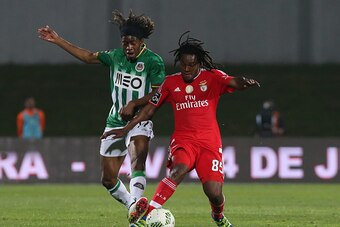 VILA DO CONDE, PORTUGAL - APRIL 24: SL Benfica's midfielder Renato Sanches with Rio Ave FC's midfielder Joris Kayembe in action during the Primeira Liga match between Rio Ave FC and SL Benfica at Estadio dos Arcos on April 24, 2016 in Lisbon, Portugal. (P