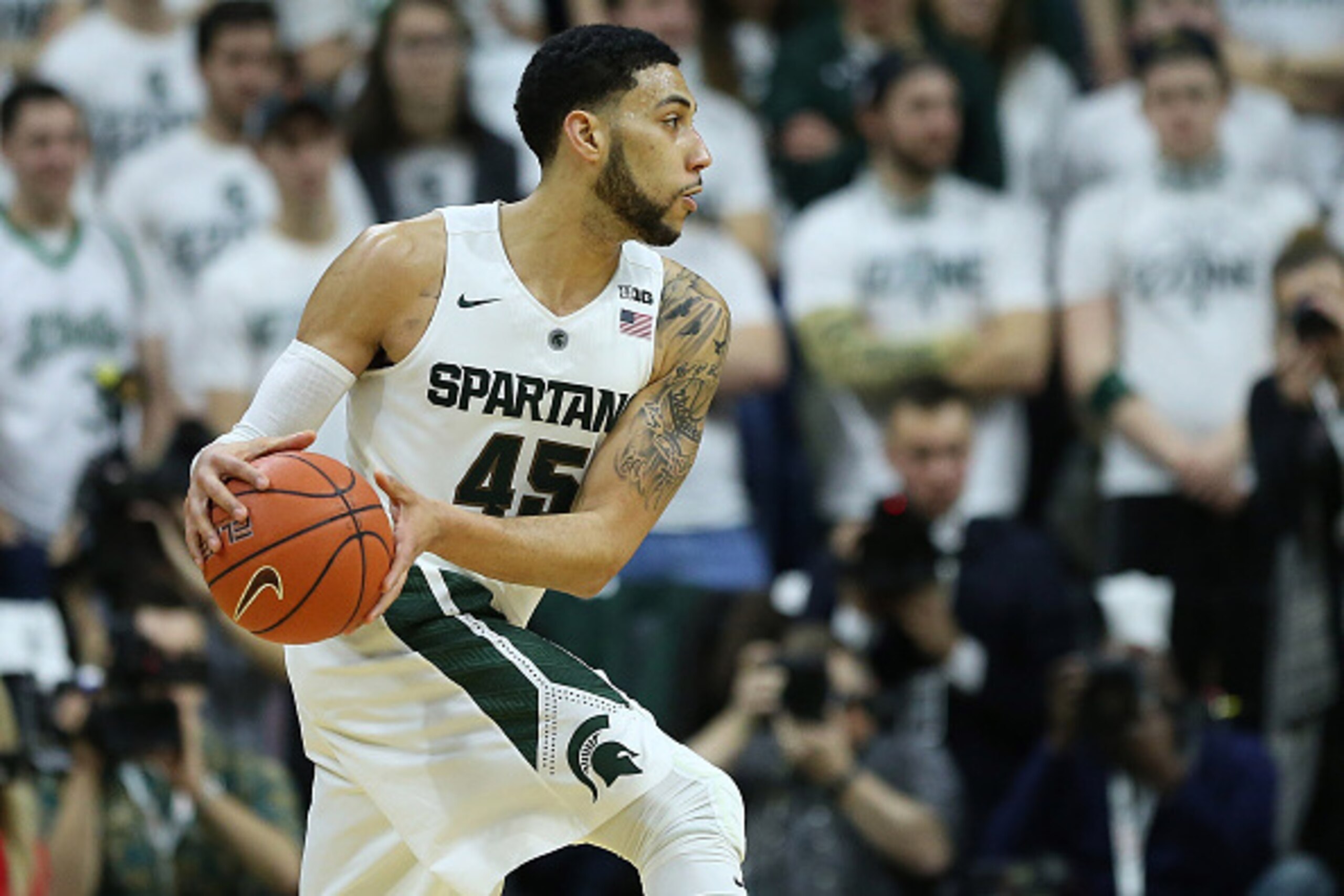 EAST LANSING MI - MARCH 5: Denzel Valentine #45 of the Michigan State Spartans looks to pass the ball during the second half of the game against the Ohio State Buckeyes on March 5, 2016 at the Breslin Center in East Lansing, Michigan. The Spartans defeate