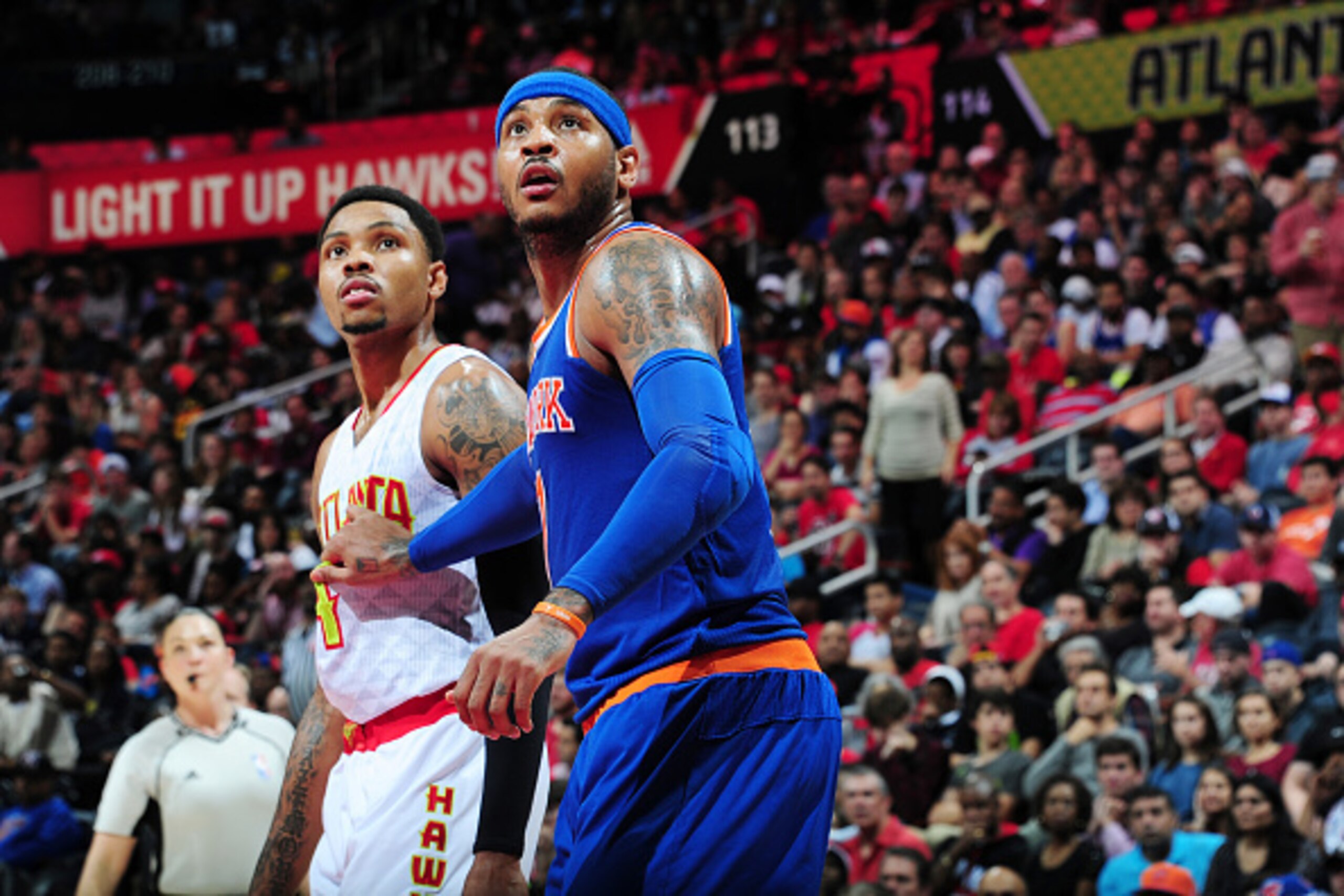 ATLANTA, GA - DECEMBER 26: Kent Bazemore #24 of the Atlanta Hawks looks for the rebound against Carmelo Anthony #7 of the New York Knicks during the game on December 26, 2015 at Philips Arena in Atlanta, Georgia. NOTE TO USER: User expressly acknowledges 