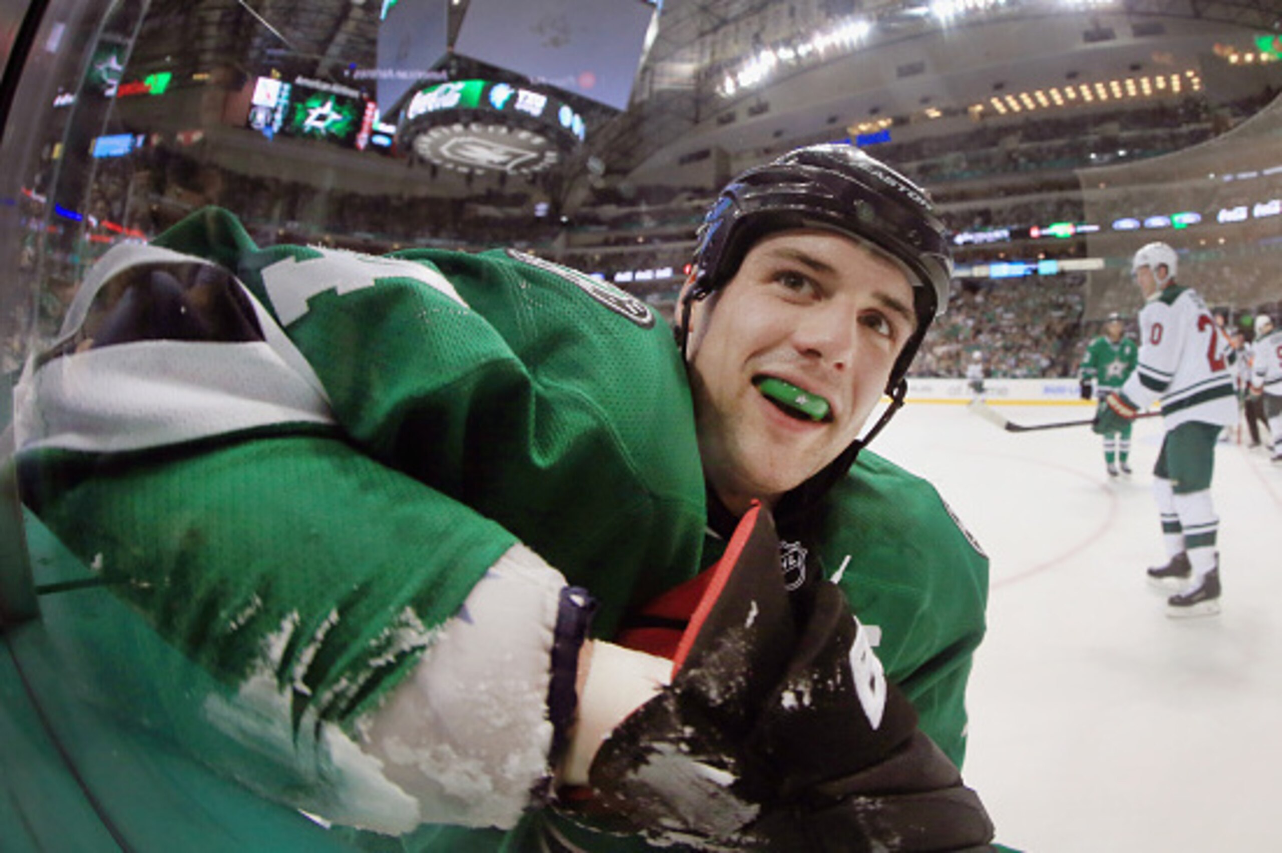 DALLAS, TX - APRIL 16:  Jamie Benn #14 of the Dallas Stars reacts after being checked into the boards by the Minnesota Wild in the first period in Game Two of the Western Conference Quarterfinals during the 2016 NHL Stanley Cup Playoffs at American Airlin