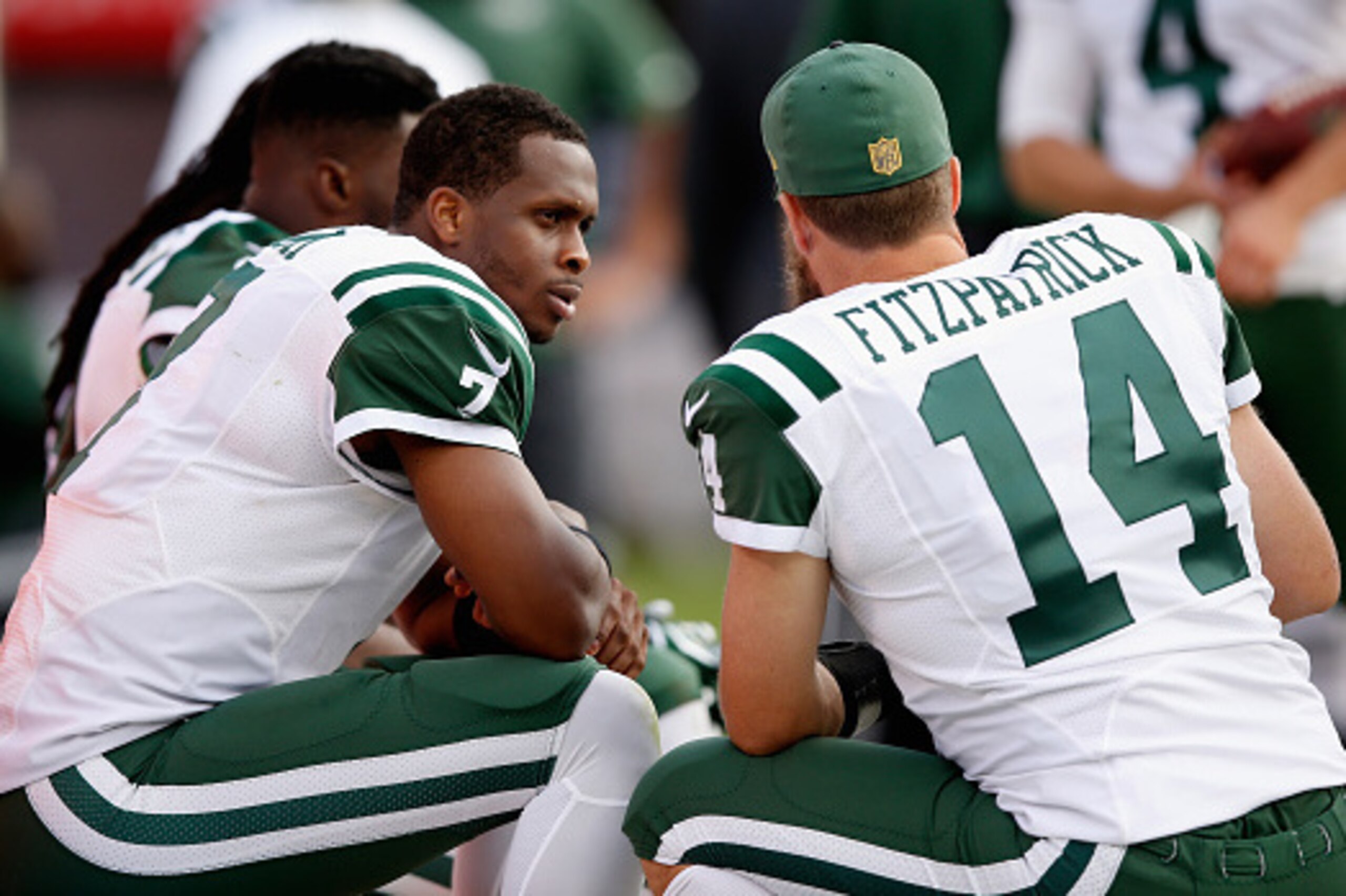 OAKLAND, CA - NOVEMBER 01:  Geno Smith #7 of the New York Jets talks to Ryan Fitzpatrick #14 on the sidelines during their game against the Oakland Raiders at O.co Coliseum on November 1, 2015 in Oakland, California.  (Photo by Ezra Shaw/Getty Images)
