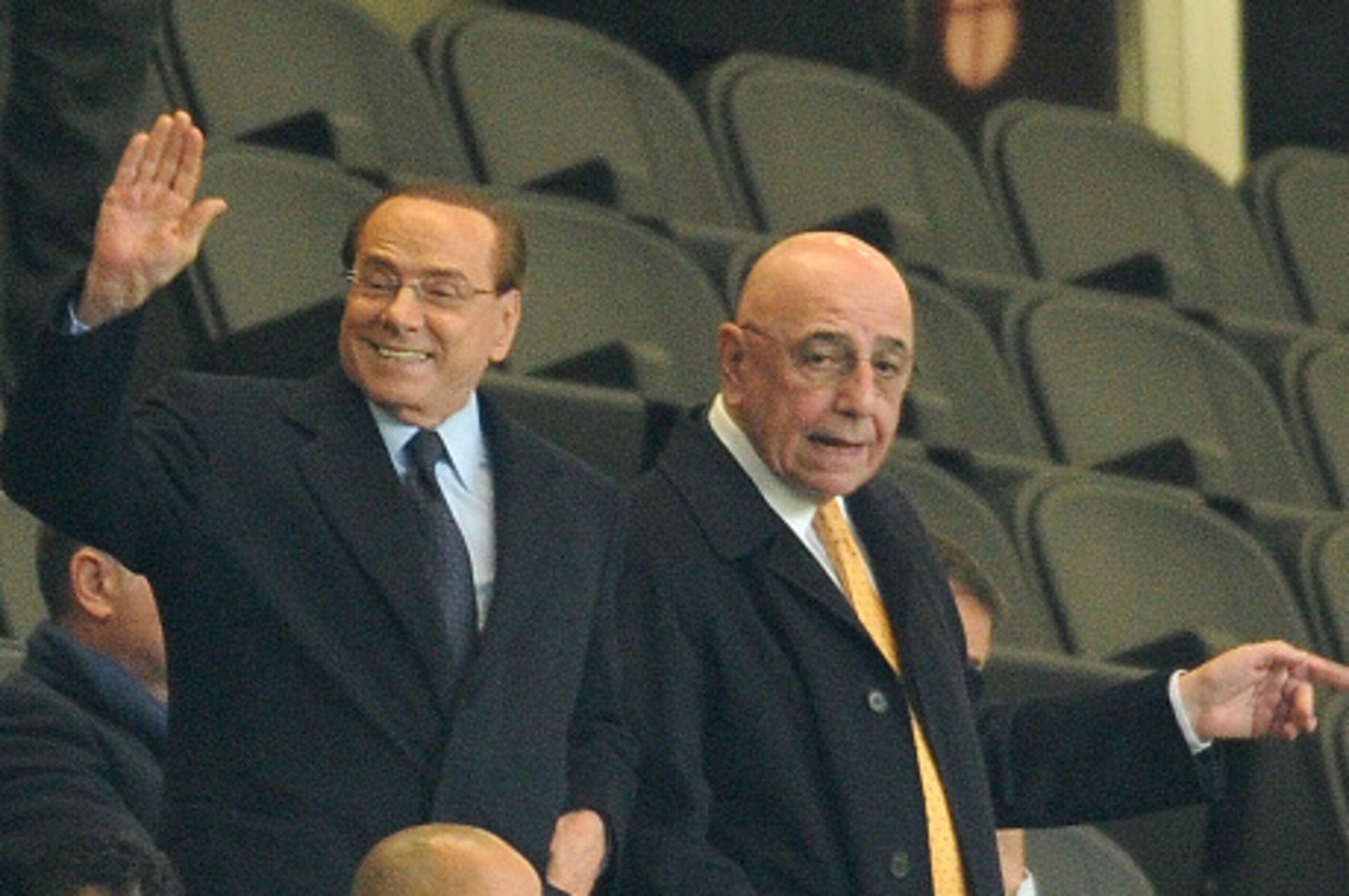 MILAN, ITALY - OCTOBER 21: (L-R) President of AC Milan Silvio Berlusconi and Adriano Galliani atend the Berlusconi Trophy match between AC Milan and FC Internazionale at Stadio Giuseppe Meazza on October 21, 2015 in Milan, Italy. (Photo by Pier Marco Ta MILAN, ITALY - OCTOBER 21: (L-R) President of AC Milan Silvio Berlusconi and Adriano Galliani atend the Berlusconi Trophy match between AC Milan and FC Internazionale at Stadio Giuseppe Meazza on October 21, 2015 in Milan, Italy. (Photo by Pier Marco Ta
