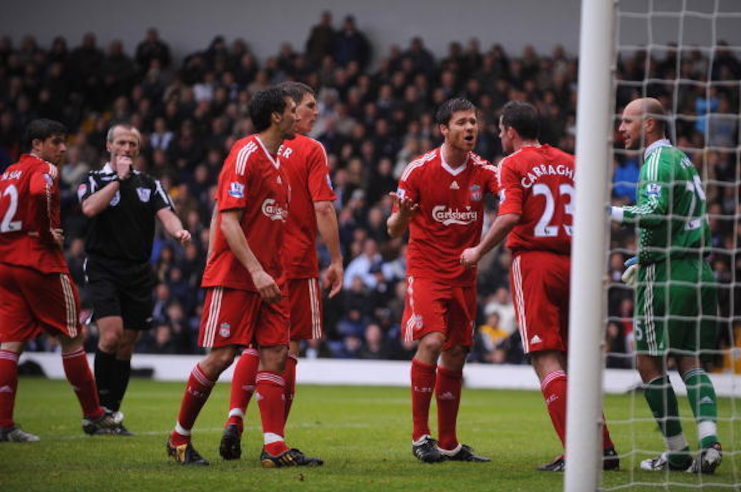 WEST BROMWICH, UNITED KINGDOM - MAY 17:  Jamie Carragher of Liverpool is calmed down by his team mates following an altercation with team mate Alvaro Arbeloa during the Barclays Premier League match between West Bromwich Albion and Liverpool at The Hawtho