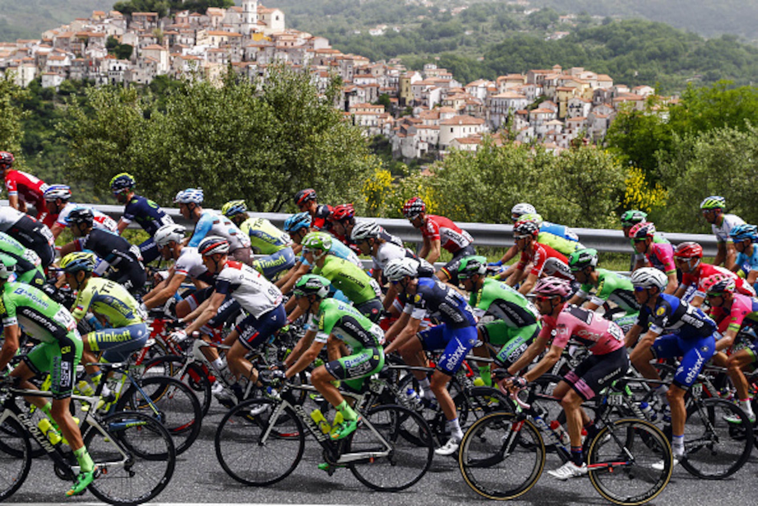 The pack rides past Rivello village during the 5th stage of 99th Giro d'Italia, Tour of Italy, from Praia a Mare to Benevento of 233 km on May 11, 2016 in Benevento.  / AFP / Luk BENIES        (Photo credit should read LUK BENIES/AFP/Getty Images)