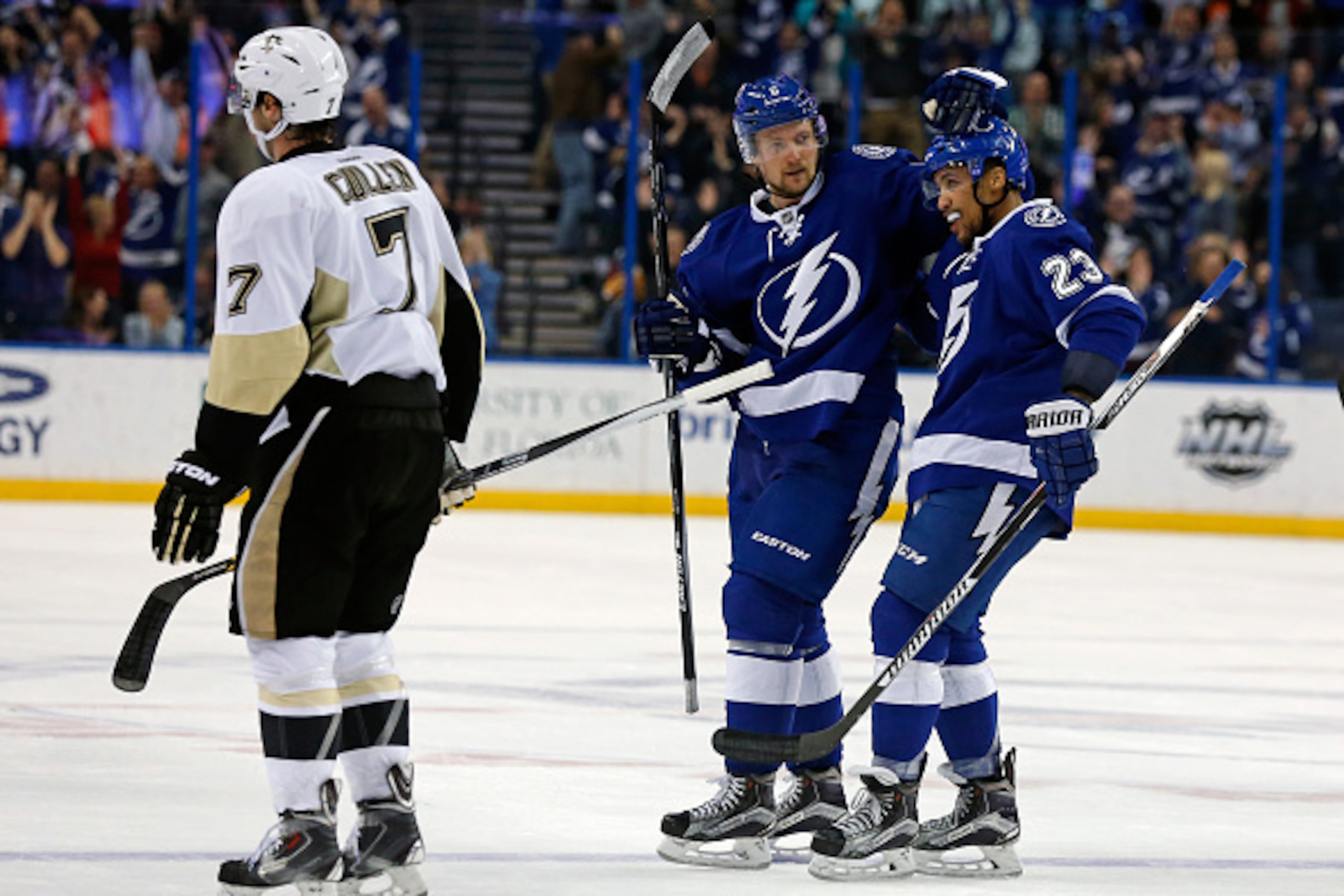 TAMPA, FL - FEBRUARY 5: Anton Stralman #6 of the Tampa Bay Lightning celebrates his goal with J.T. Brown #23 as Matt Cullen #7 of the Pittsburgh Penguins reacts during the third period at the Amalie Arena on February 5, 2016 in Tampa, Florida. (Photo by M