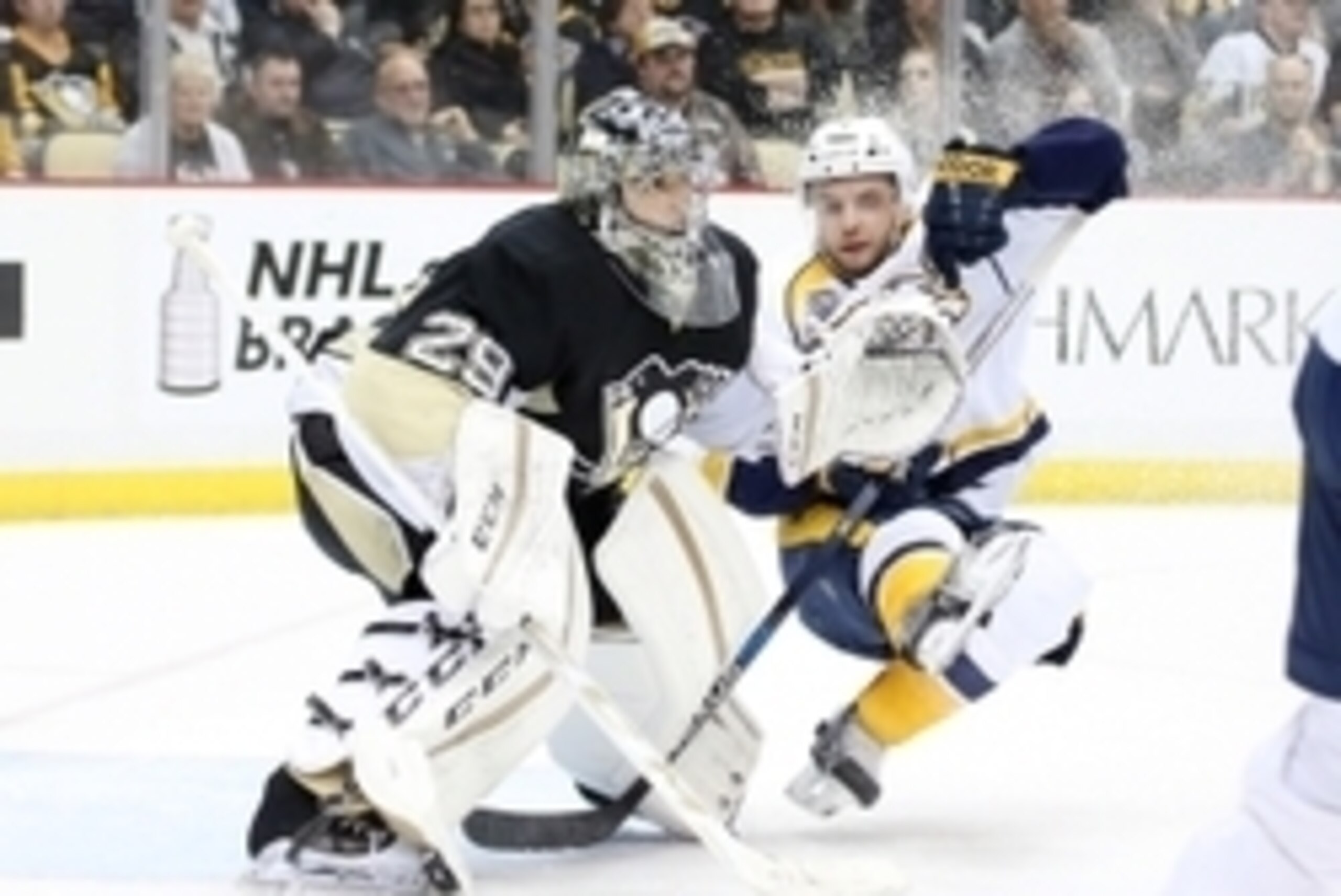 Mar 31, 2016; Pittsburgh, PA, USA; Nashville Predators defenseman Stefan Elliott (7) loses his footing in front of Pittsburgh Penguins goalie Marc-Andre Fleury (29) during the third period at the CONSOL Energy Center.The Penguins won 5-2.  Mandatory Credi