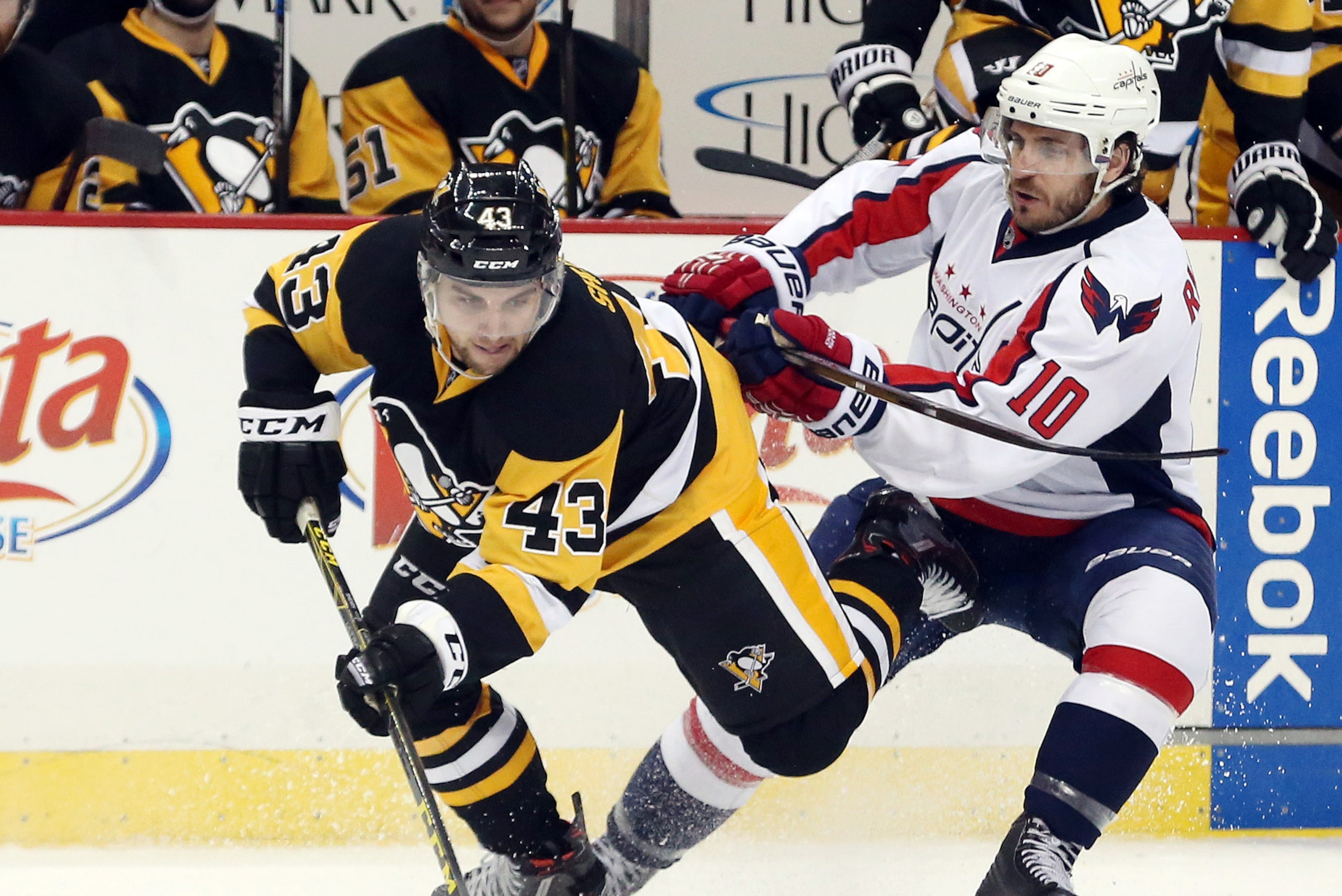 May 4, 2016; Pittsburgh, PA, USA; Pittsburgh Penguins left wing Conor Sheary (43) chases the puck as Washington Capitals center Mike Richards (10) checks during the third period in game four of the second round of the 2016 Stanley Cup Playoffs at the CONS