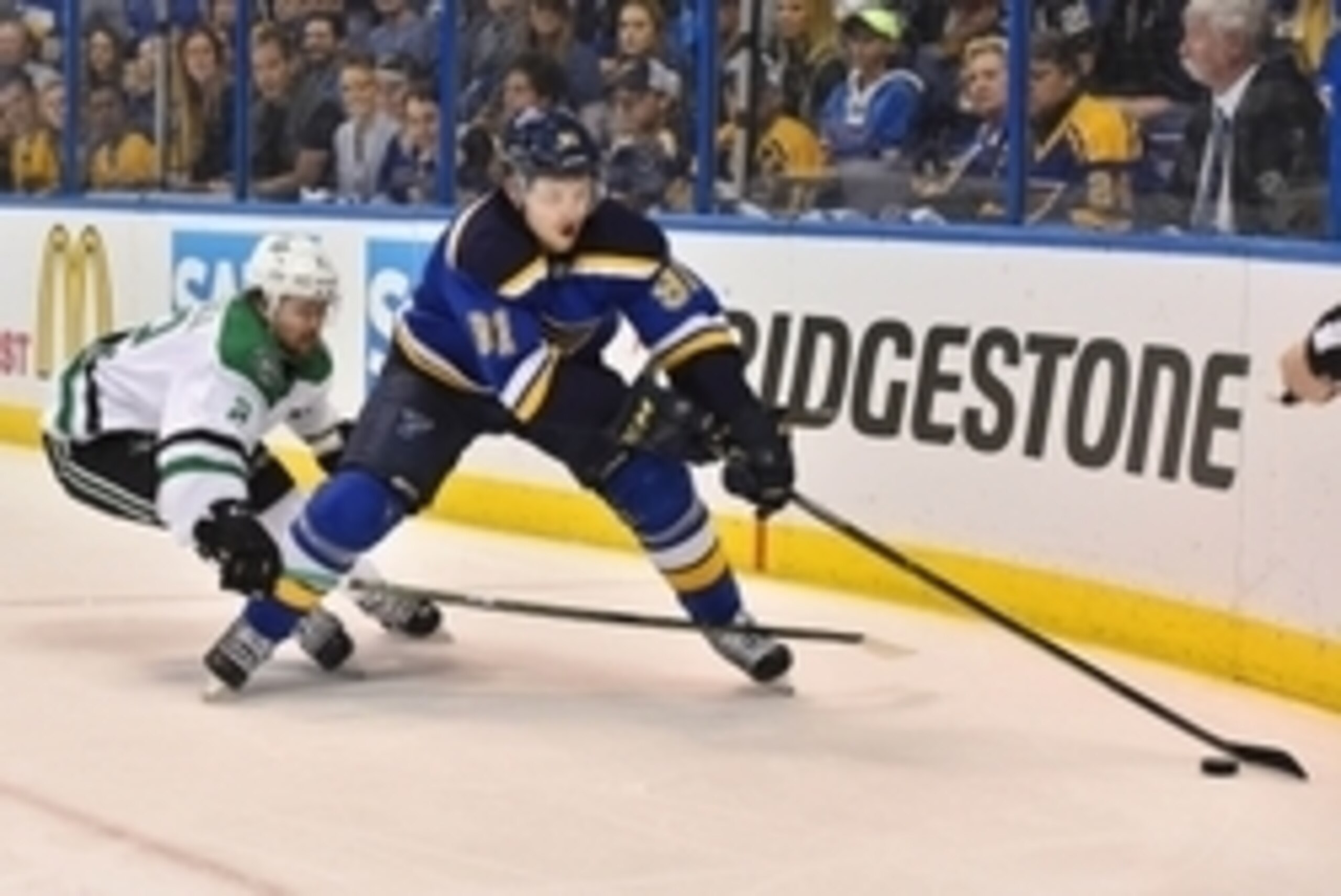 May 9, 2016; St. Louis, MO, USA; Dallas Stars defenseman Kris Russell (2) reaches for the puck on St. Louis Blues right wing Vladimir Tarasenko (91) during the second period in game six of the second round of the 2016 Stanley Cup Playoffs at Scottrade Cen