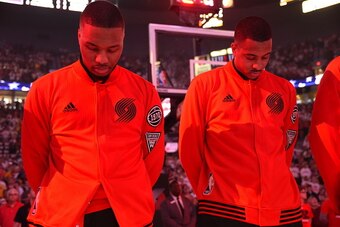 PORTLAND, OR - MAY 7:  Damian Lillard #0 of the Portland Trail Blazers and C.J. McCollum #3 of the Portland Trail Blazers stand for the national anthem before the game against the Golden State Warriors in Game Three of the Western Conference Semifinals du