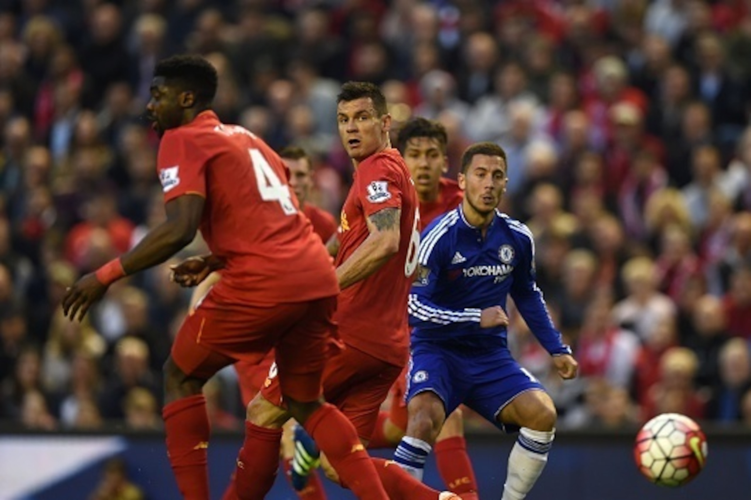 Chelsea's Belgian midfielder Eden Hazard (R) watches his goal-bound shot as Liverpool's Ivorian defender Kolo Toure (L), Liverpool's English midfielder James Milner (2nd L), Liverpool's Croatian defender Dejan Lovren (3rd L) and Liverpool's Brazilian midf