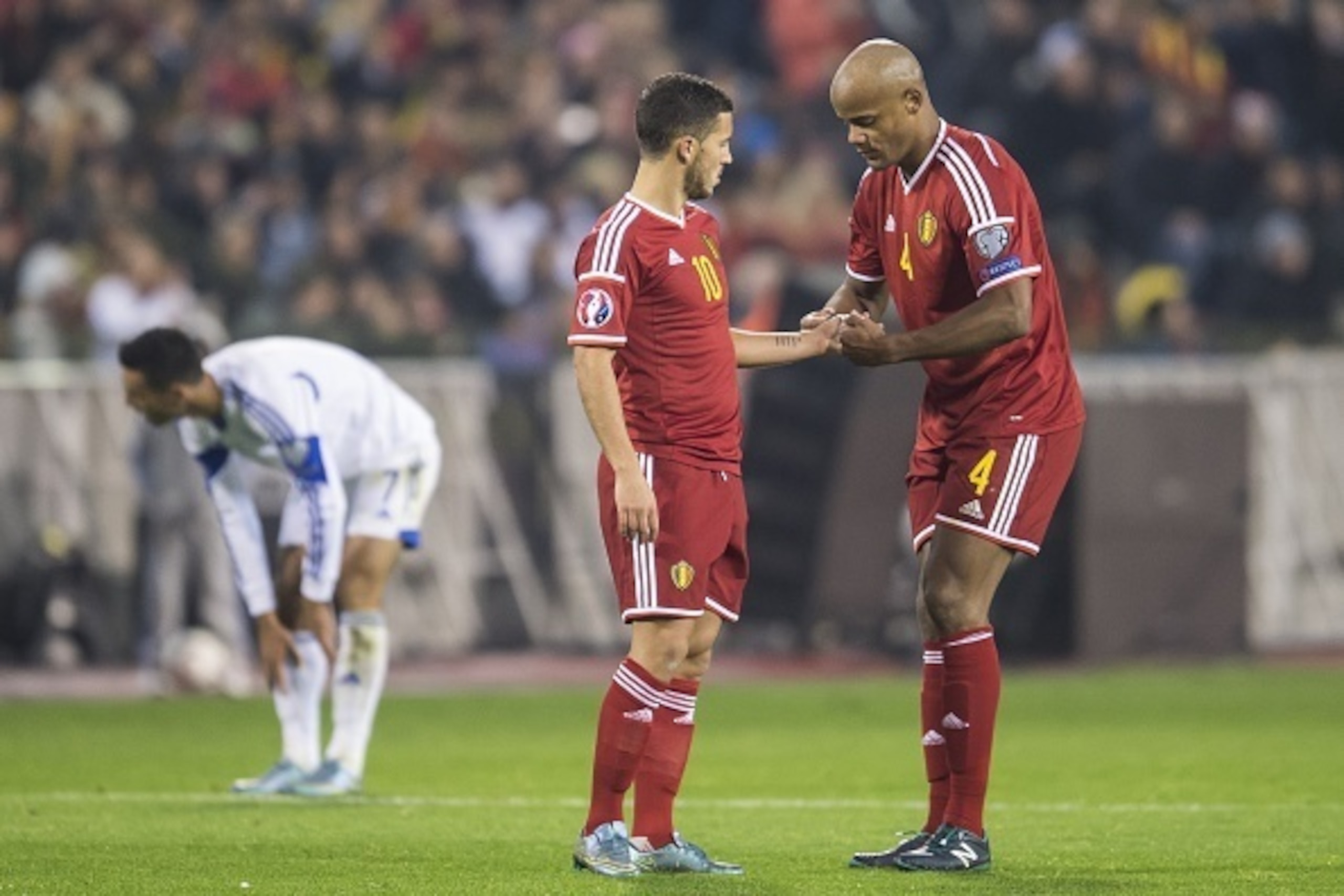 Vincent Kompany of Belgium gives the captains-band to Eden Hazard of Belgium during the UEFA EURO 2016 group B qualifying match between Belgium and Israel on October 13, 2015 at the Koning Boudewijn stadium in Brussels, Belgium.(Photo by VI Images via Get