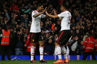 LONDON, ENGLAND - APRIL 13:  Marcus Rashford of Manchester United celebrates scoring the opening goal with Anthony Martial of Manchester United during The Emirates FA Cup, sixth round replay between West Ham United and Manchester United at the Boleyn Grou