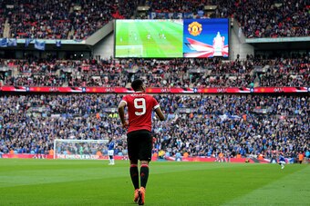 LONDON, ENGLAND - APRIL 23:  Anthony Martial of Manchester United heads to the centre circle after scoring the winning goal to make the score 1-2 during the Emirates FA Cup Semi Final match between Everton and Manchester United at Wembley Stadium on April