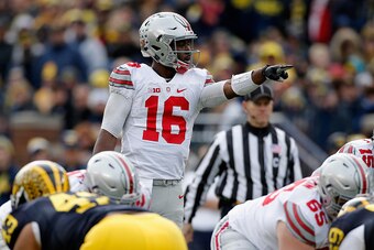 ANN ARBOR, MI - NOVEMBER 28: Quarterback J.T. Barrett #16 of the Ohio State Buckeyes motions from the line of scrimmage against the Michigan Wolverines in the third quarter at Michigan Stadium on November 28, 2015 in Ann Arbor, Michigan.  (Photo by Gregor