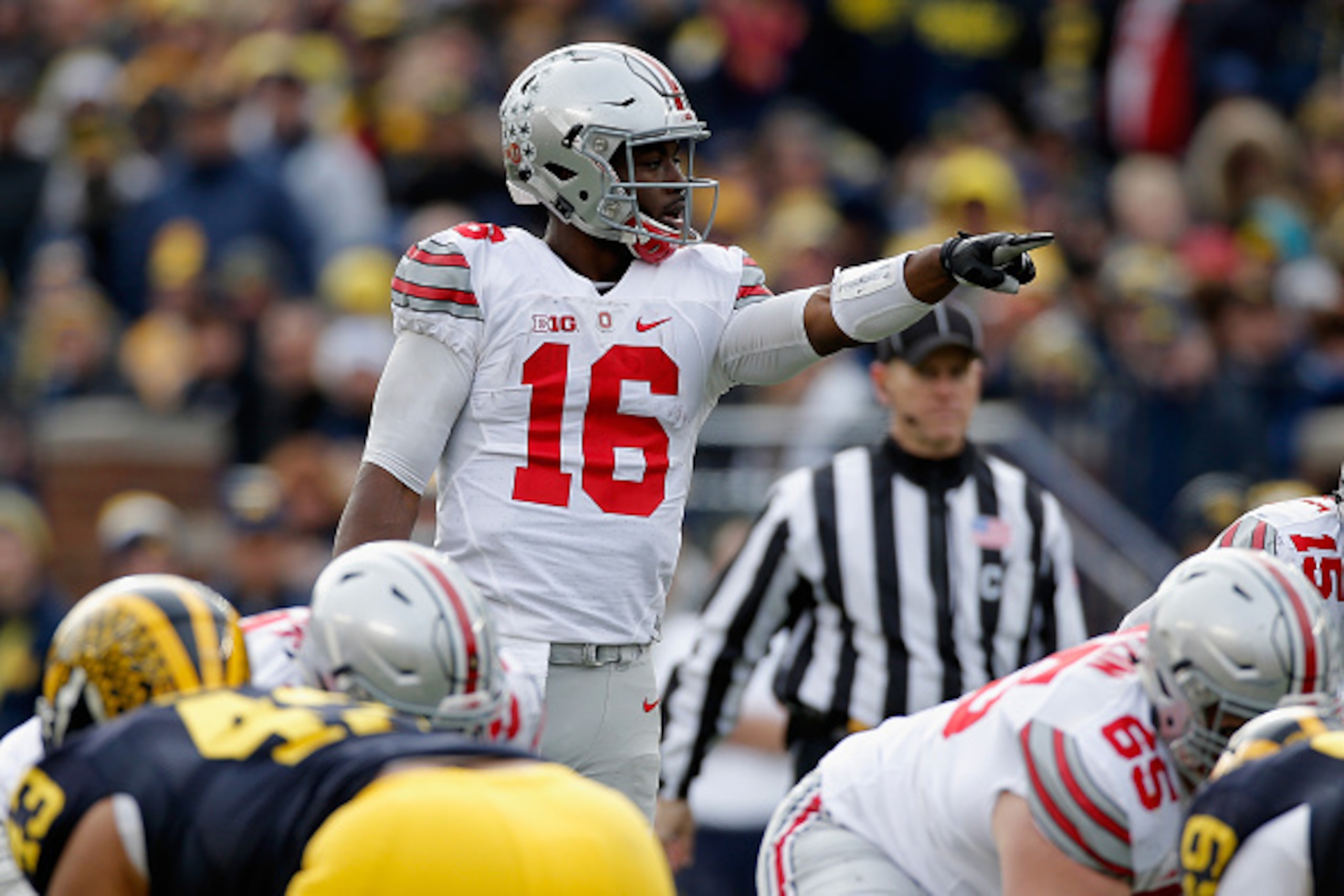 ANN ARBOR, MI - NOVEMBER 28: Quarterback J.T. Barrett #16 of the Ohio State Buckeyes motions from the line of scrimmage against the Michigan Wolverines in the third quarter at Michigan Stadium on November 28, 2015 in Ann Arbor, Michigan.  (Photo by Gregor