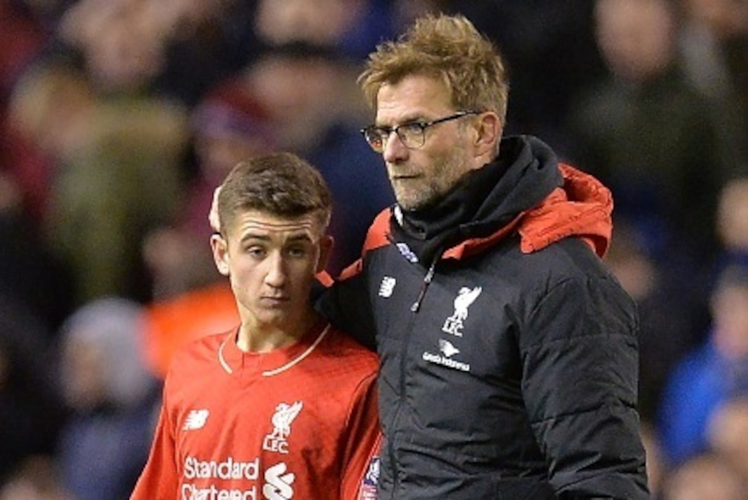 Liverpool's German manager Jurgen Klopp (R) speaks with Liverpool's English midfielder Cameron Brannagan after the end of the English FA Cup fourth round football match between Liverpool and West Ham United at Anfield in Liverpool, north west England, on 