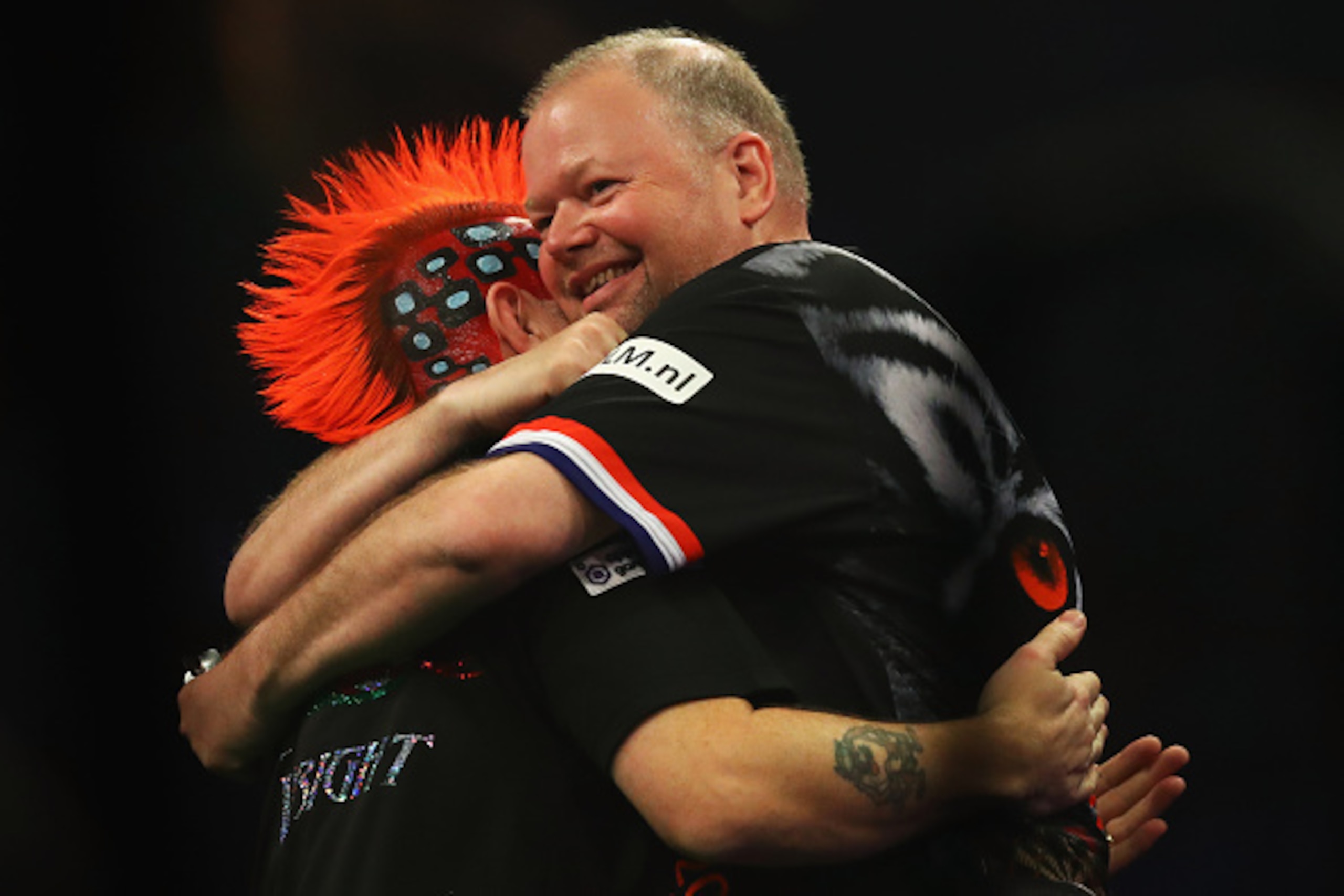ROTTERDAM, NETHERLANDS - MAY 12:  Peter Wright of Scotland and Raymond van Barneveld of the Netherlands embrace prior to the Darts Betway Premier League Night 15 at Rotterdam Ahoy on May 12, 2016 in Rotterdam, .  (Photo by Dean Mouhtaropoulos/Getty Images