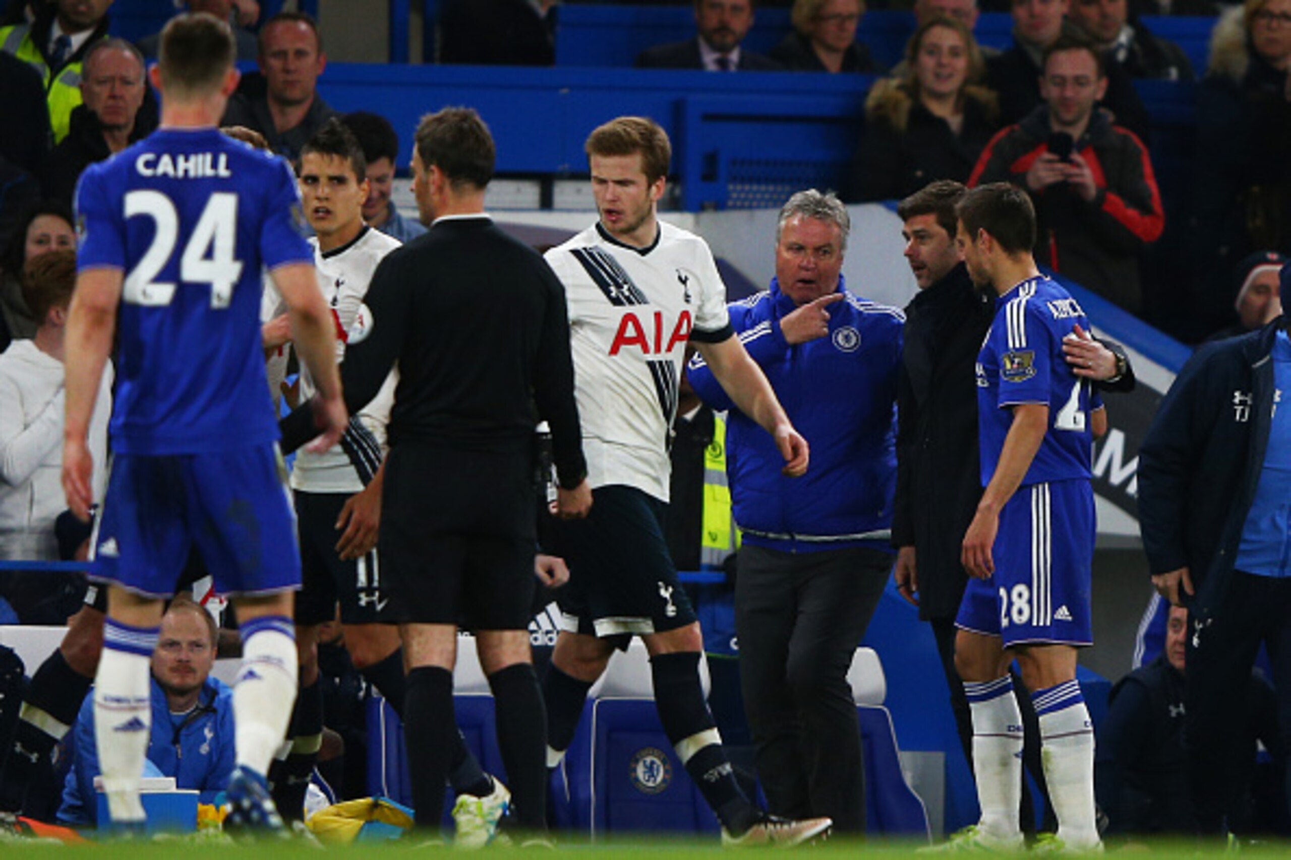 LONDON, ENGLAND - MAY 02:  Guus Hiddink the interim manager of Chelsea and Mauricio Pochettino the manager of Tottenham Hotspur acts as peace makers after one of numerous scuffles breaks out during the Barclays Premier League match between Chelsea and Tot
