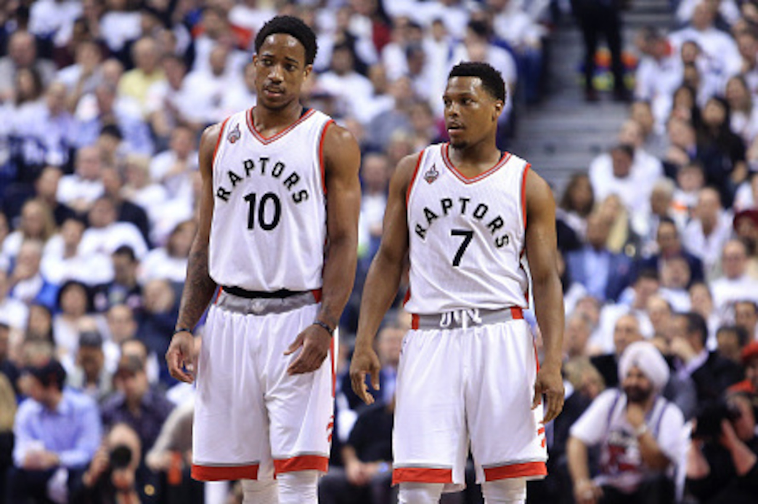 TORONTO, ON - MAY 11:  DeMar DeRozan #10 and Kyle Lowry #7 of the Toronto Raptors talk in the first half of Game Five of the Eastern Conference Semifinals against the Miami Heat during the 2016 NBA Playoffs at the Air Canada Centre on May 11, 2016 in Toro