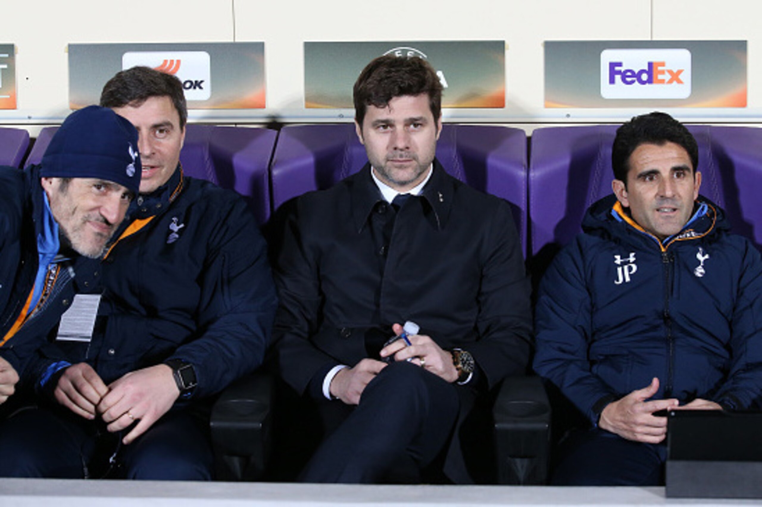 FLORENCE - FEBRUARY 18: Coach of Tottenham Mauricio Pochettino seats on the bench between his assistant coaches Toni Jimenez, Miguel D'Agostino and Jesus Perez during the UEFA Europa League round of 32 first leg match between Fiorentina and Tottenham Hots