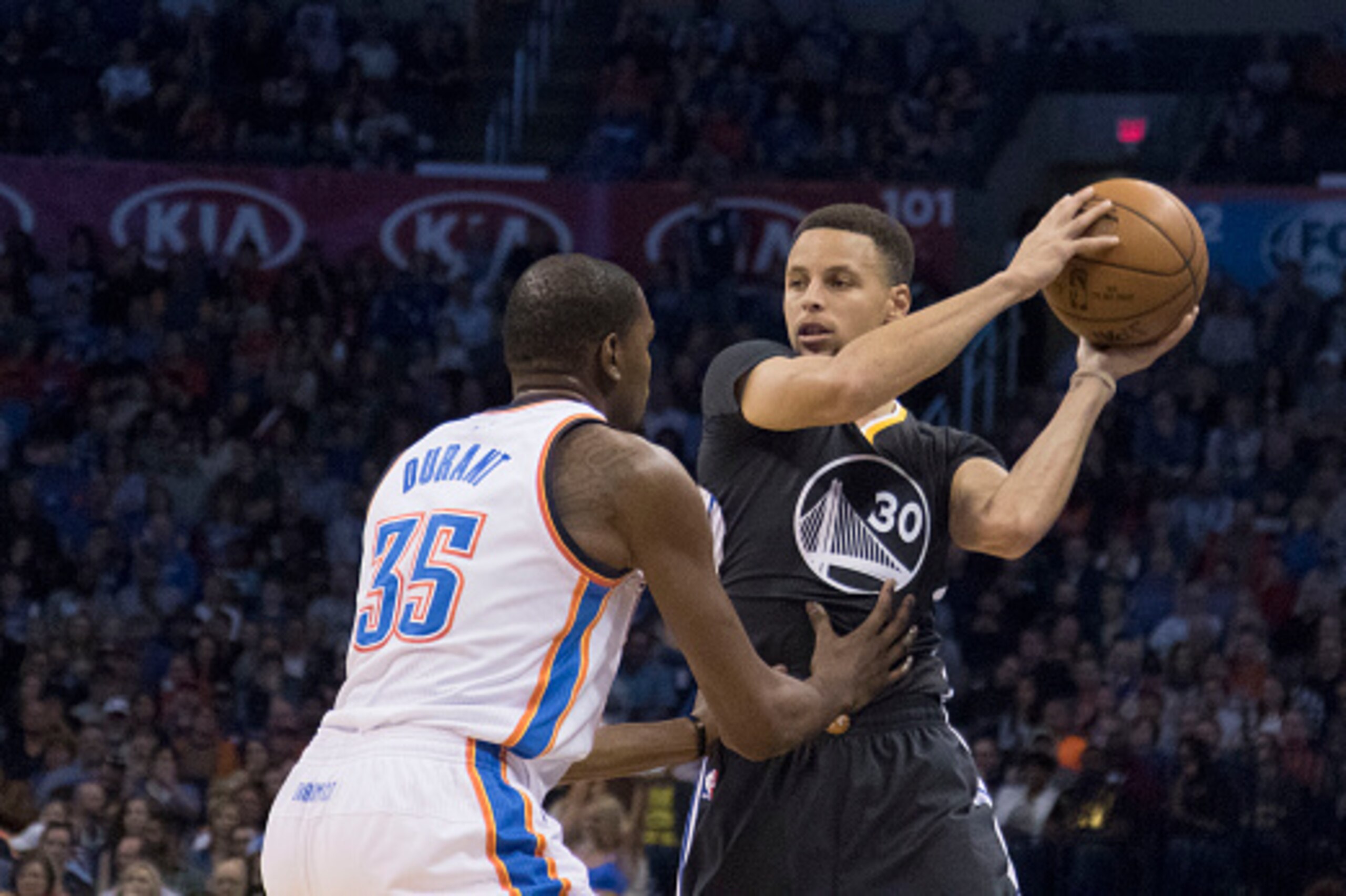 OKLAHOMA CITY, OK - FEBRUARY 27: Stephen Curry #30 of the Golden State Warriors looks for a play as Kevin Durant #35 of the Oklahoma City Thunder apples pressure during the first quarter of a NBA game at the Chesapeake Energy Arena on February 27, 2016 in