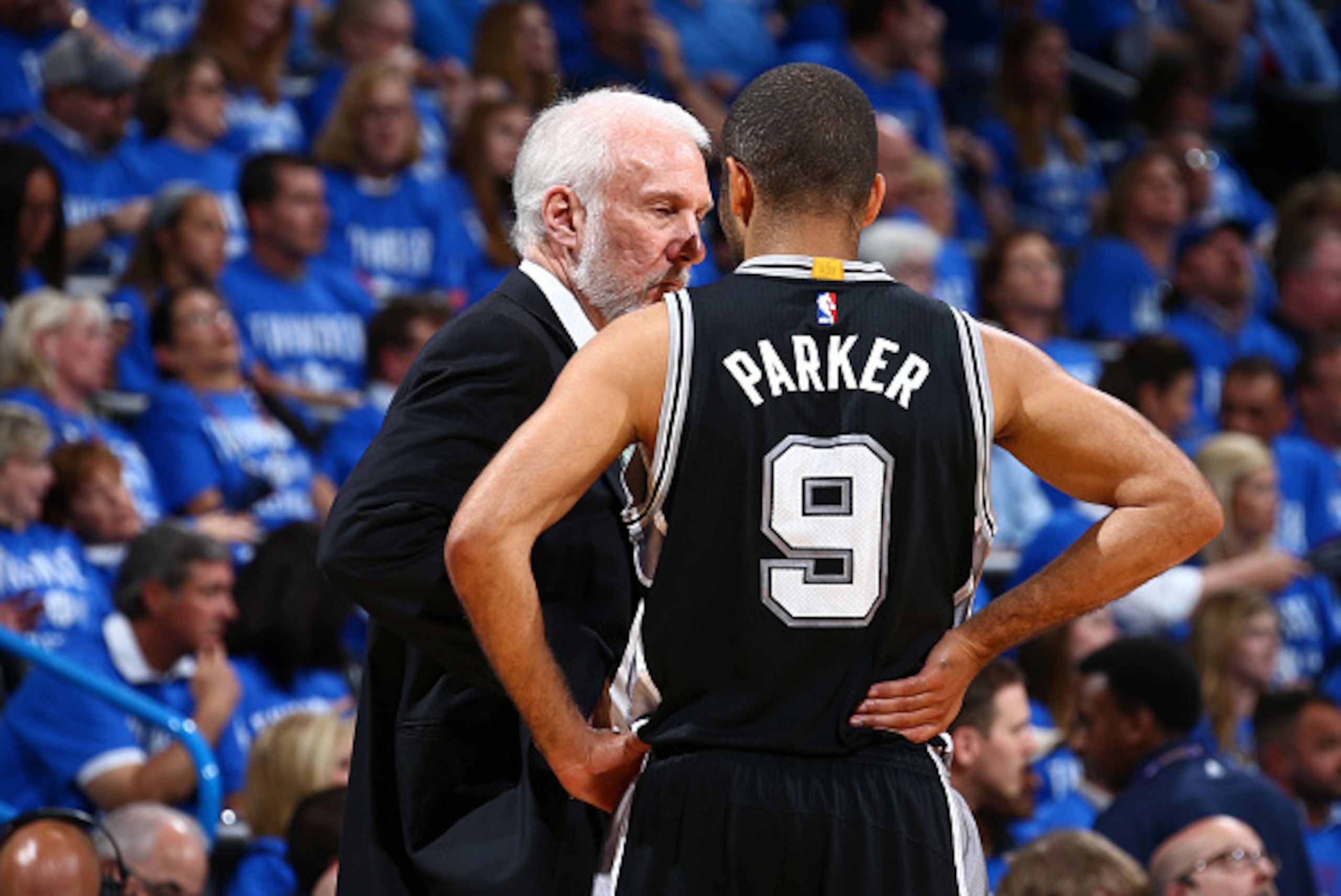 OKLAHOMA CITY, OK- MAY 12:  Head coach Gregg Popovich and Tony Parker #9 of the San Antonio Spurs talk during the game against the Oklahoma City Thunder in Game Six of the Western Conference Semifinals during the 2016 NBA Playoffs on May 12, 2016 at Chesa