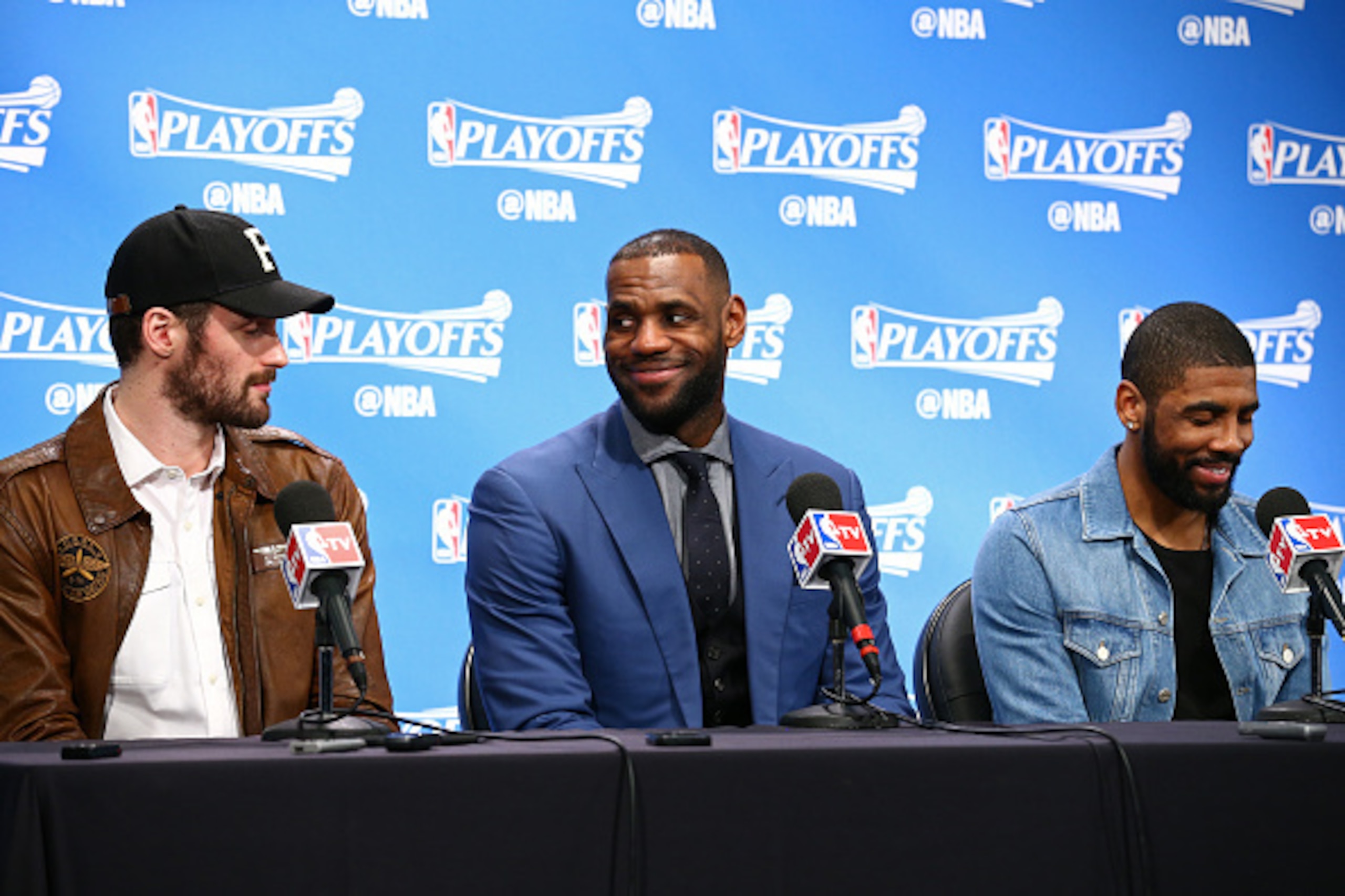 AUBURN HILLS, MI - APRIL 24:  Kevin Love #0, LeBron James #23 and Kyrie Irving #2 of the Cleveland Cavaliers speak at a press conference after Game Four of the Eastern Conference Quarterfinals against the Detroit Pistons during the 2016 NBA Playoffs on  A
