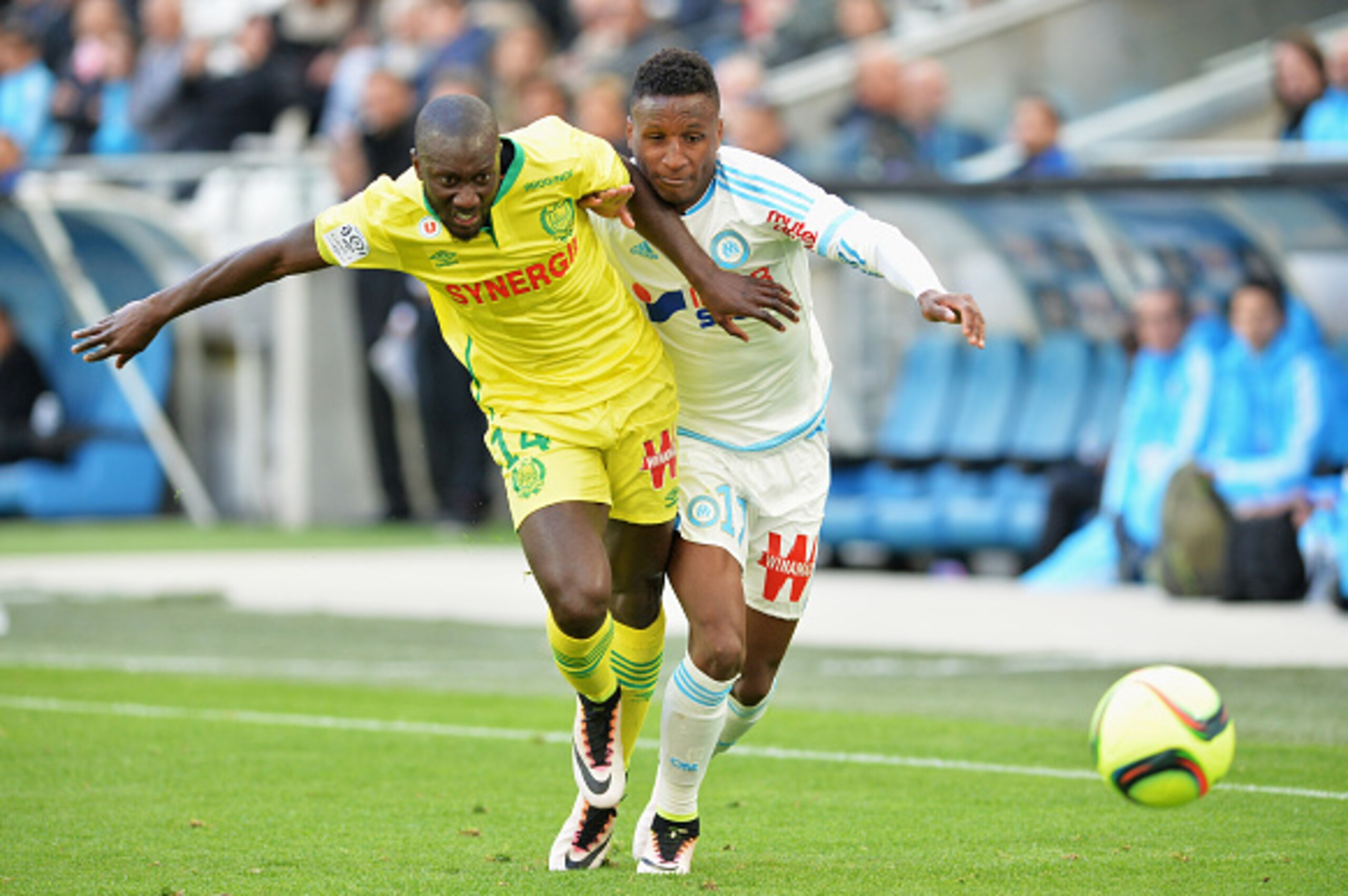 MARSEILLE, FRANCE - APRIL 24:  Bouna Sarr from Marseille fight with Youssouf Sabaly during the game between Olympique de Marseille v FC Nantes at Stade Velodrome on April 24, 2016 in Marseille, France.  (Photo by Pascal Rondeau/Getty Images)