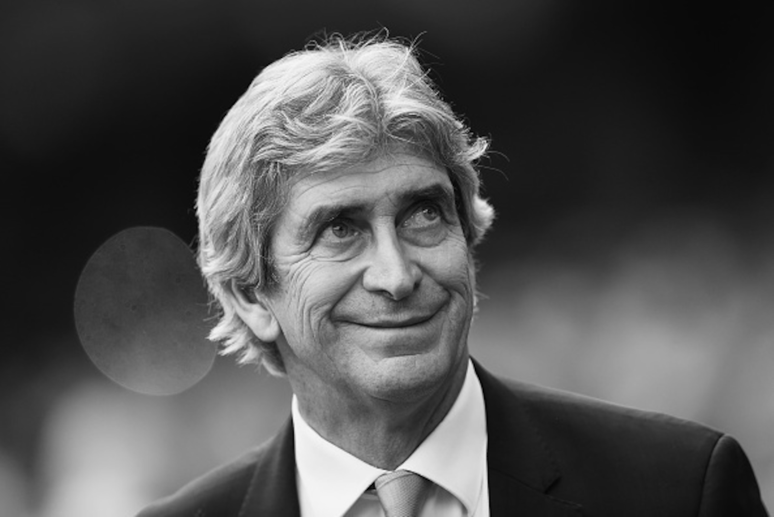 MANCHESTER, ENGLAND - MAY 08: (EDITORS NOTE: IMAGE CONVERTED TO BLACK AND WHITE)  Manuel Pellegrini of Manchester City looks on during the Barclays Premier League match between Manchester City and Arsenal at the Etihad Stadium on May 8, 2016 in Manchester