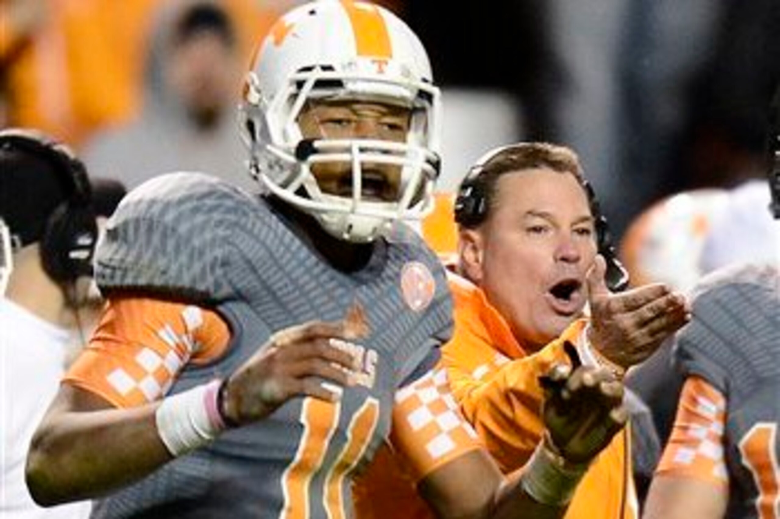 Tennessee QB Joshua Dobbs (left) and head coach Butch Jones