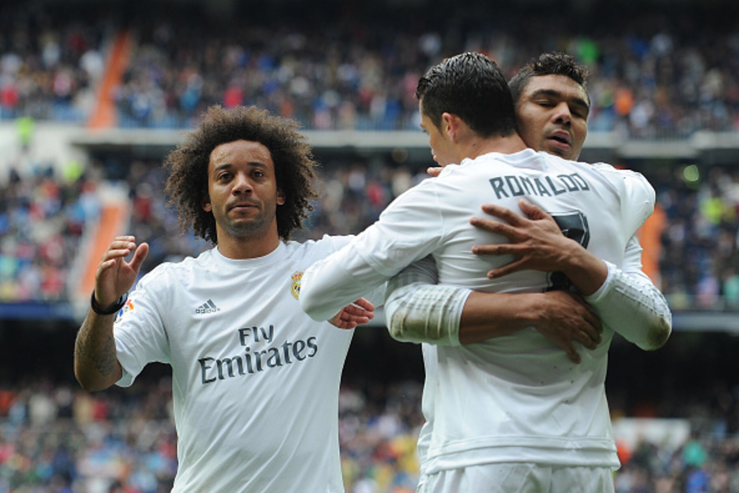 MADRID, SPAIN - MAY 08:  Cristiano Ronaldo of Real Madrid celebrates with Henrique Casemiro and Marcelo after scoring his team's 3rd goal during the La Liga match between Real Madrid CF and Valencia CF at Estadio Santiago Bernabeu on May 8, 2016 in Madrid