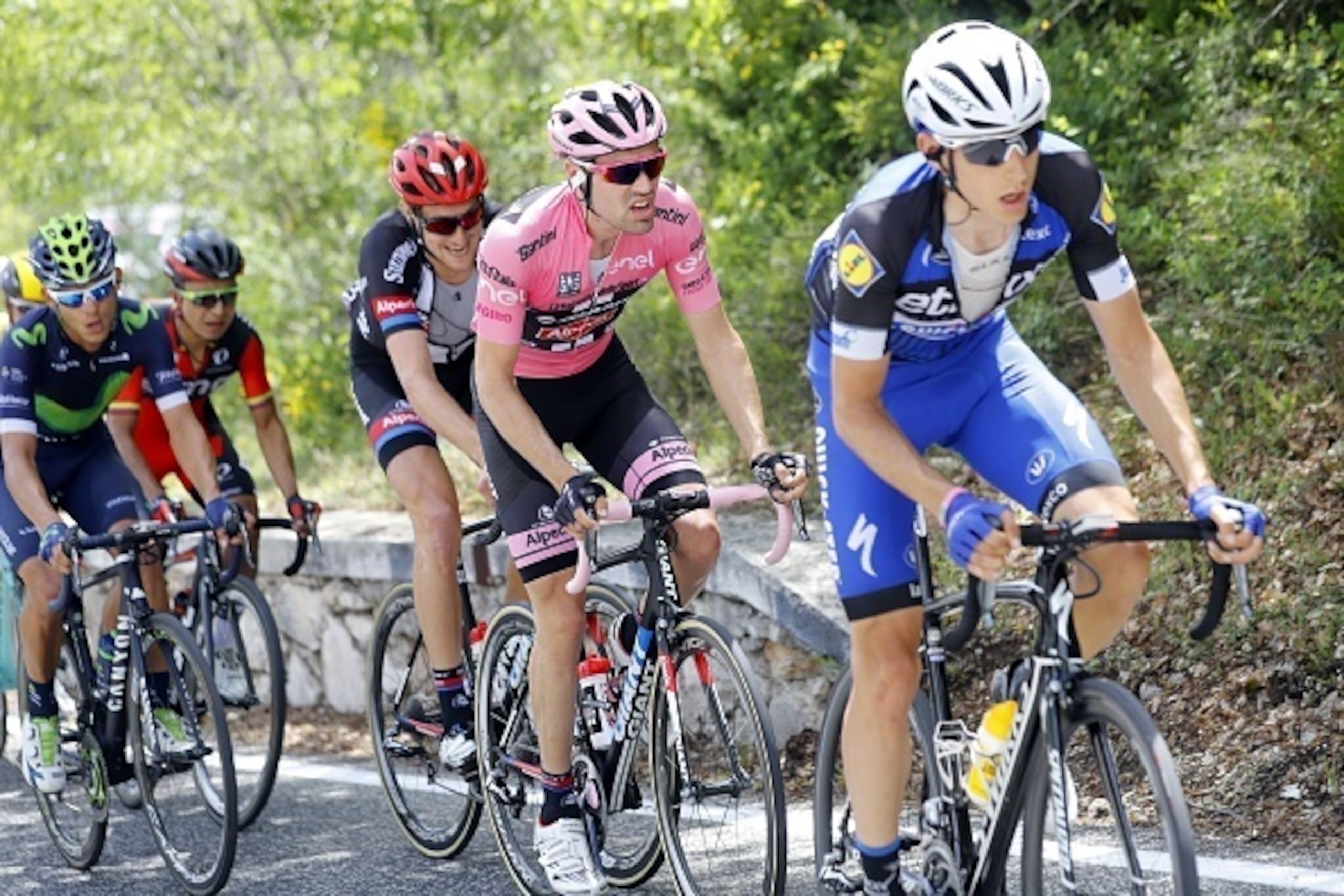 Dutch pink jersey Tom Dumoulin (C) rides during the 7th stage of the 99th Giro d'Italia, Tour of Italy, between Sulmona and Foligno, on May 13, 2016.  / AFP / Luk BENIES        (Photo credit should read LUK BENIES/AFP/Getty Images)