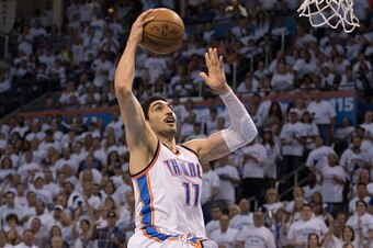 OKLAHOMA CITY, OK - MAY 8: Enes Kanter #11 of the Oklahoma City Thunder dunks two points against the San Antonio Spurs  during Game Four of the Western Conference Semifinals during the 2016 NBA Playoffs at the Chesapeake Energy Arena on May 8, 2016 in Okl