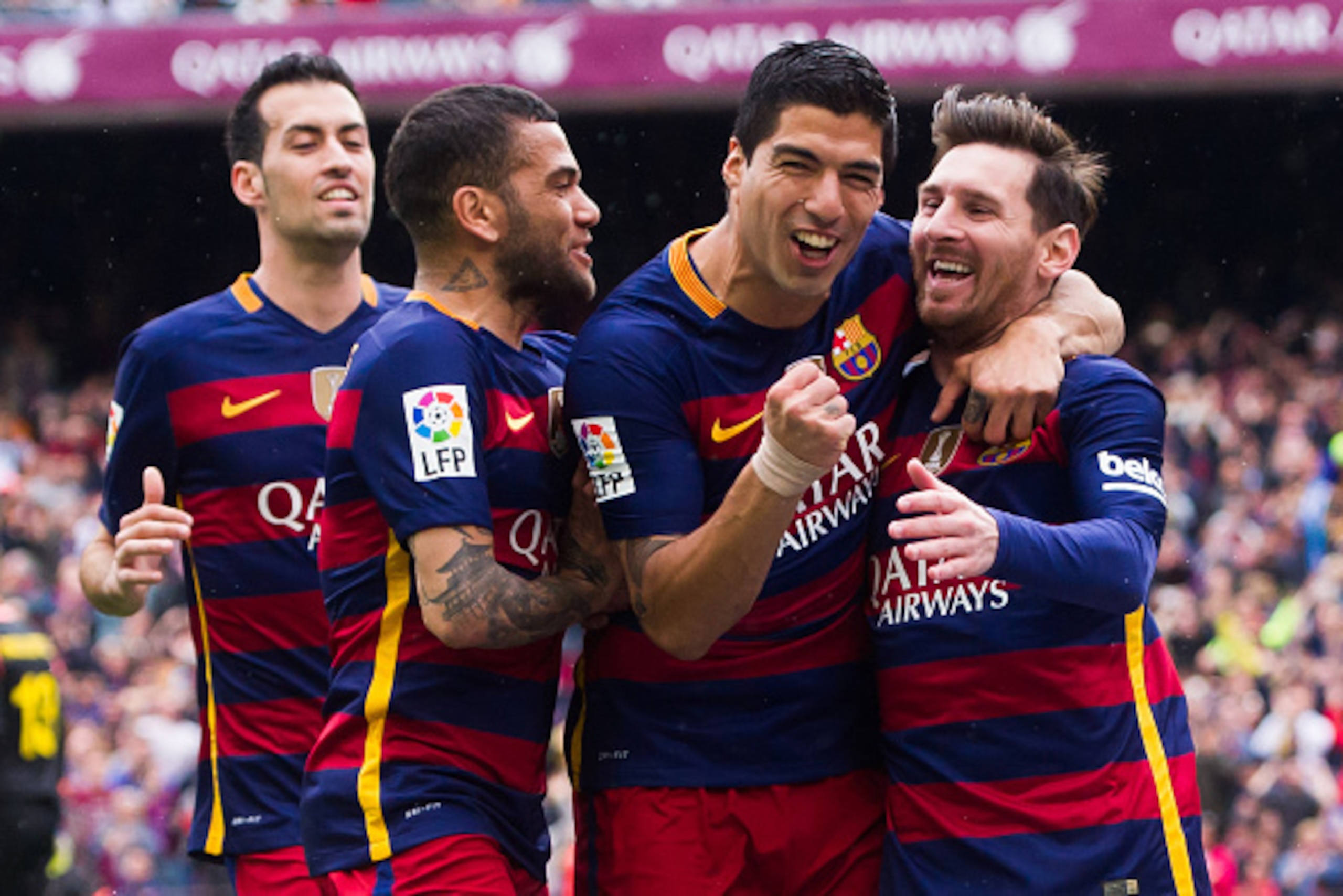 BARCELONA, SPAIN - MAY 08: (L-R) Sergio Busquets, Dani Alves and Luis Suarez celebrate with their teammate Lionel Messi after scoring the opening goal during the La Liga match between FC Barcelona and RCD Espanyol at Camp Nou on May 8, 2016 in Barcelona, BARCELONA, SPAIN - MAY 08: (L-R) Sergio Busquets, Dani Alves and Luis Suarez celebrate with their teammate Lionel Messi after scoring the opening goal during the La Liga match between FC Barcelona and RCD Espanyol at Camp Nou on May 8, 2016 in Barcelona,