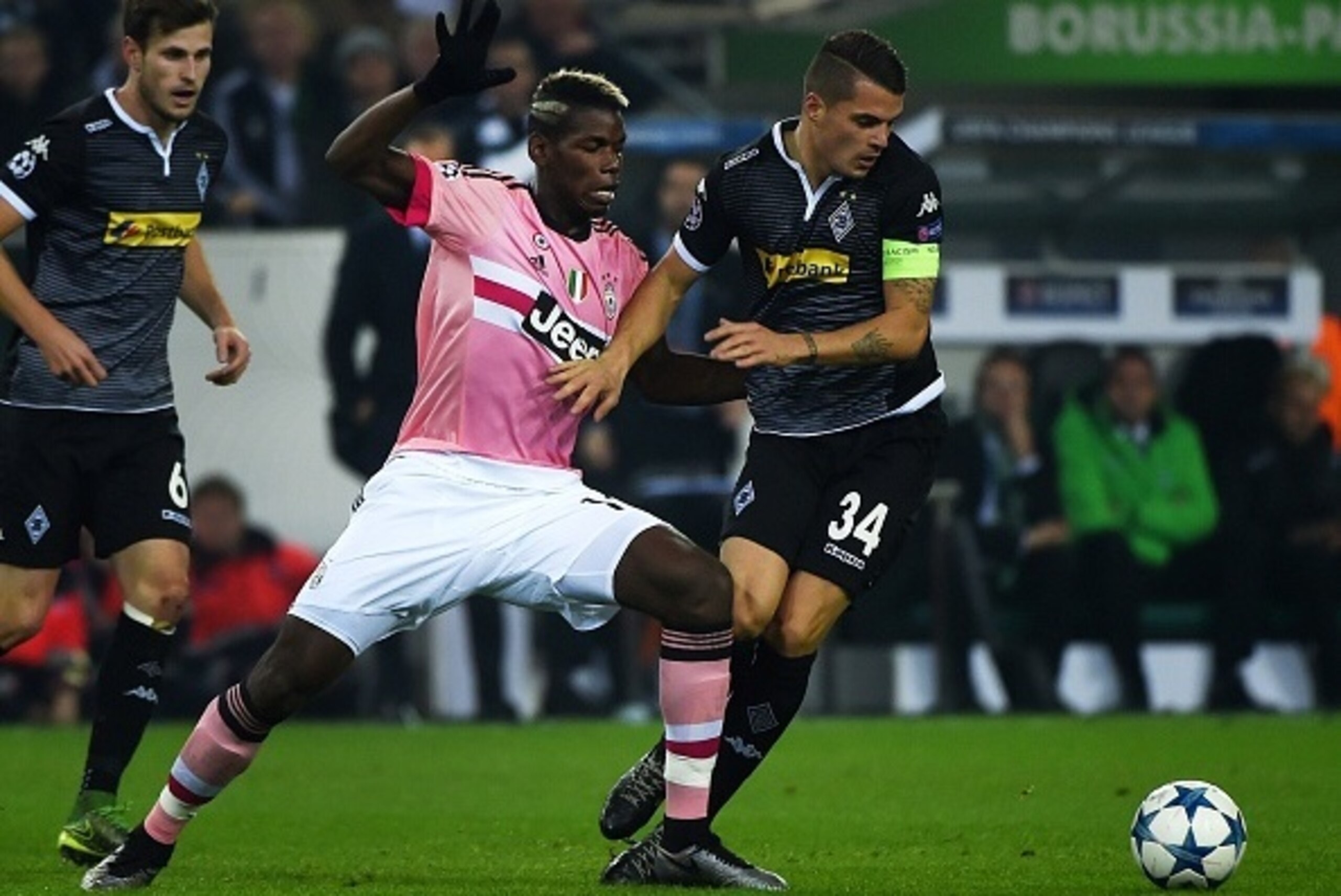 Moenchengladbach's Swiss midfielder Granit Xhaka (R) and Juventus' midfielder from France Paul Pogba vie for the ball during the UEFA Champions League Group D, second-leg football match Borussia Moenchengladbach vs Juventus in Moenchengladbach, western Ge