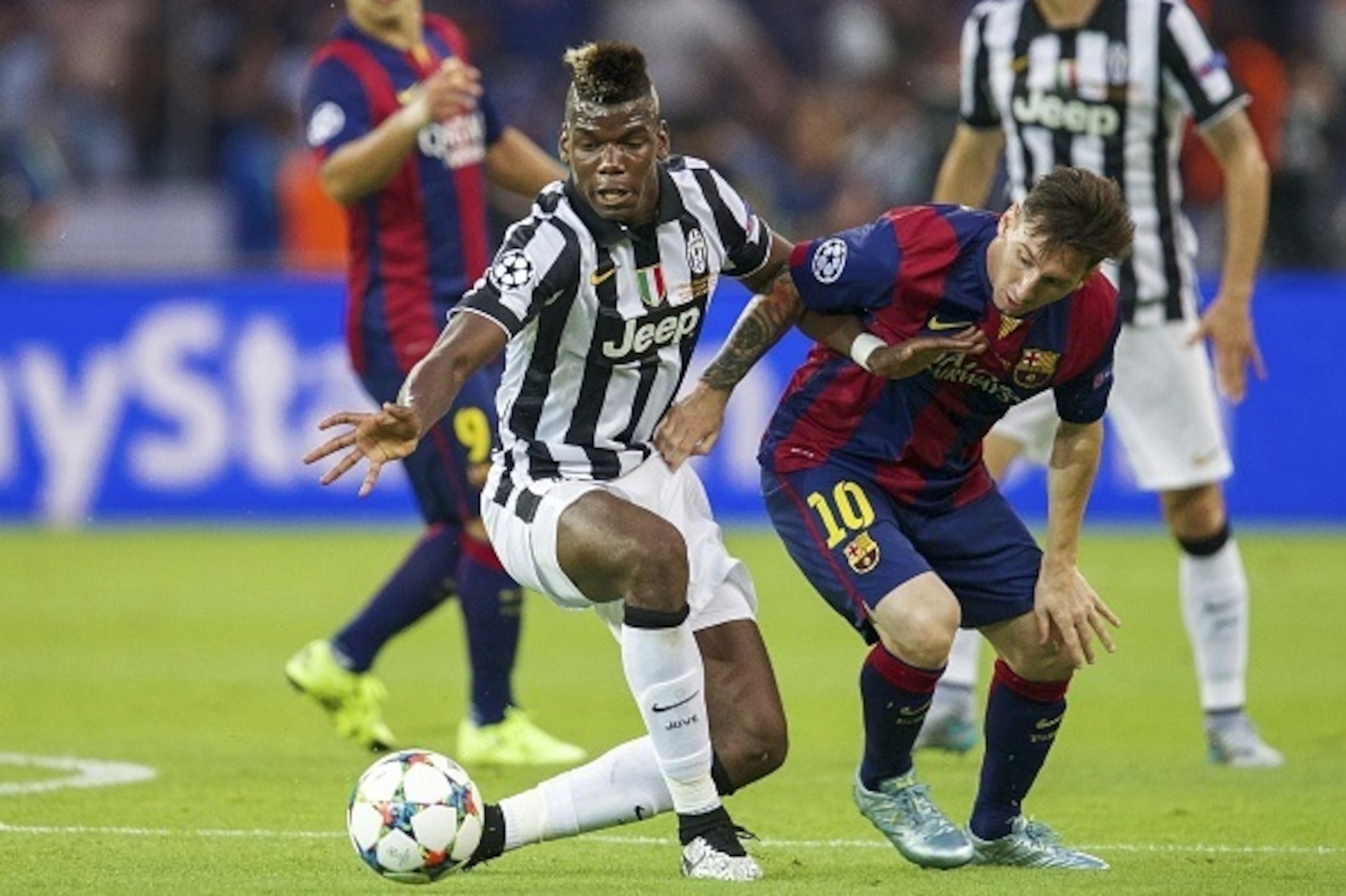 (L-R) Paul Pogba of Juventus FC, Lionel Messi of FC Barcelona during the UEFA Champions League  final match between Barcelona and Juventus on June 6, 2015 at the Olympic stadium in Berlin, Germany.(Photo by VI Images via Getty Images)