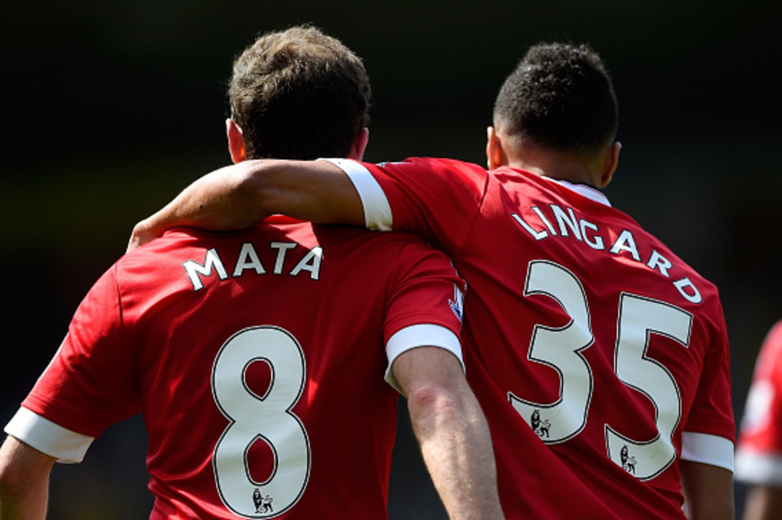 NORWICH, ENGLAND - MAY 07:  Juan Mata (L) of Manchester United celebrates scoring his team's first goal with his team mate Jesse Lingard (R) during the Barclays Premier League match between Norwich City and Manchester United at Carrow Road on May 7, 2016 