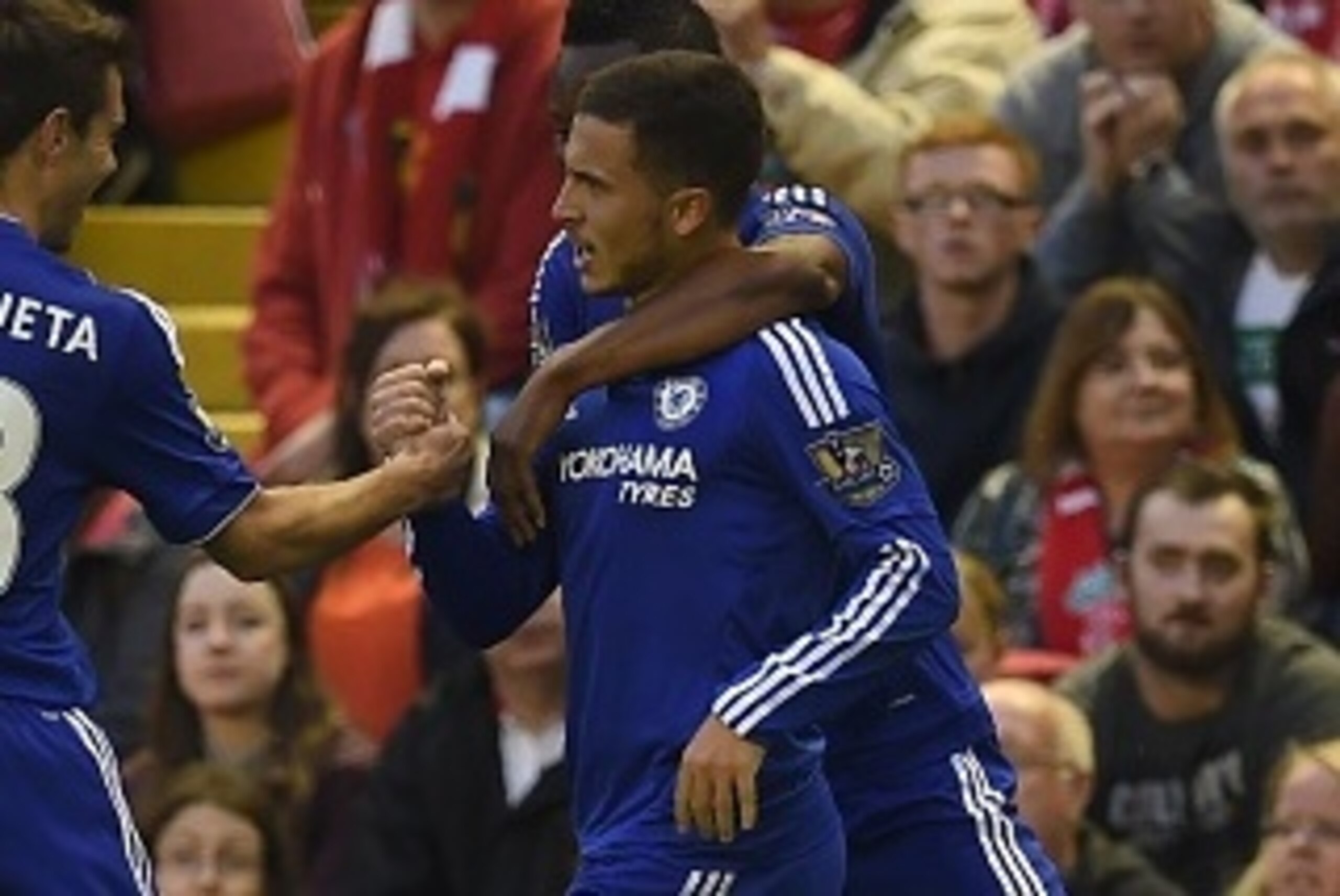 Chelsea's Belgian midfielder Eden Hazard (C) celebrates with Chelsea's Spanish defender Cesar Azpilicueta (L) and Chelsea's Nigerian midfielder John Obi Mikel after scoring the opening goal of the English Premier League football match between Liverpool an