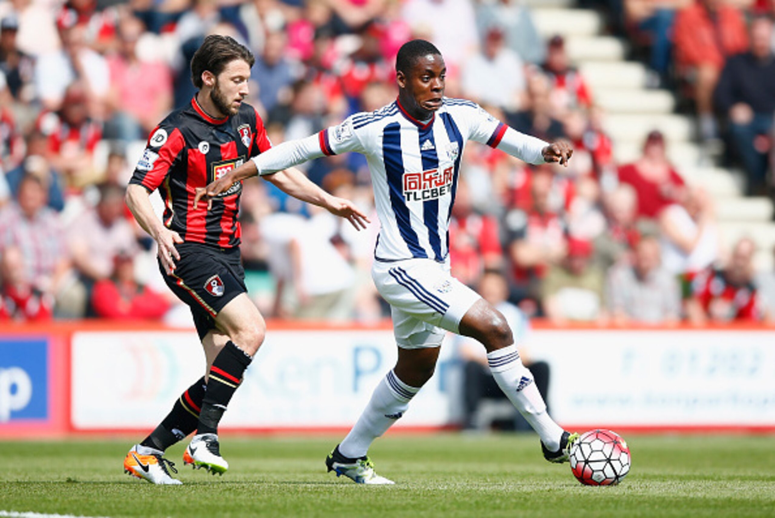 BOURNEMOUTH, ENGLAND - MAY 07:  Jonathan Leko of West Brom battles with Harry Arter of Bournemouth during the Barclays Premier League match between A.F.C. Bournemouth and West Bromwich Albion at the Vitality Stadium on May 7, 2016 in Bournemouth, United K