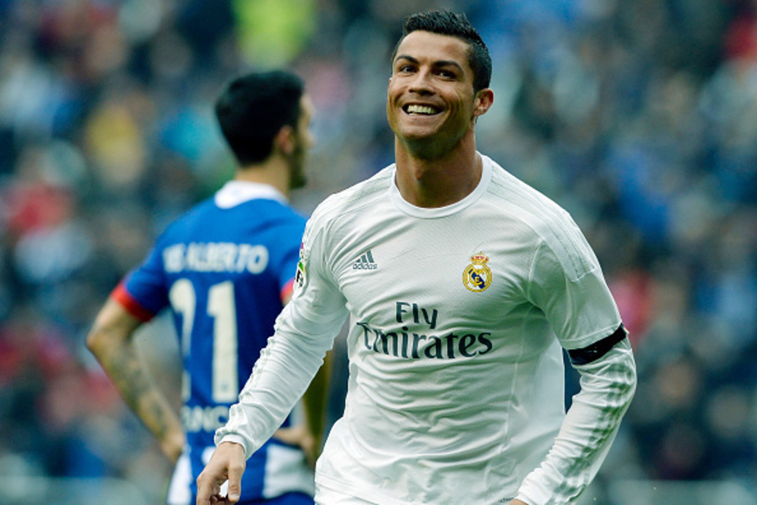 Real Madrid's Portuguese forward Cristiano Ronaldo celebrates after scoring a goal during the Spanish league football match RC Deportivo de la Coruna vs Real Madrid at the Riazor stadium in Coruna on May 14, 2016. / AFP / MIGUEL RIOPA        (Photo credit