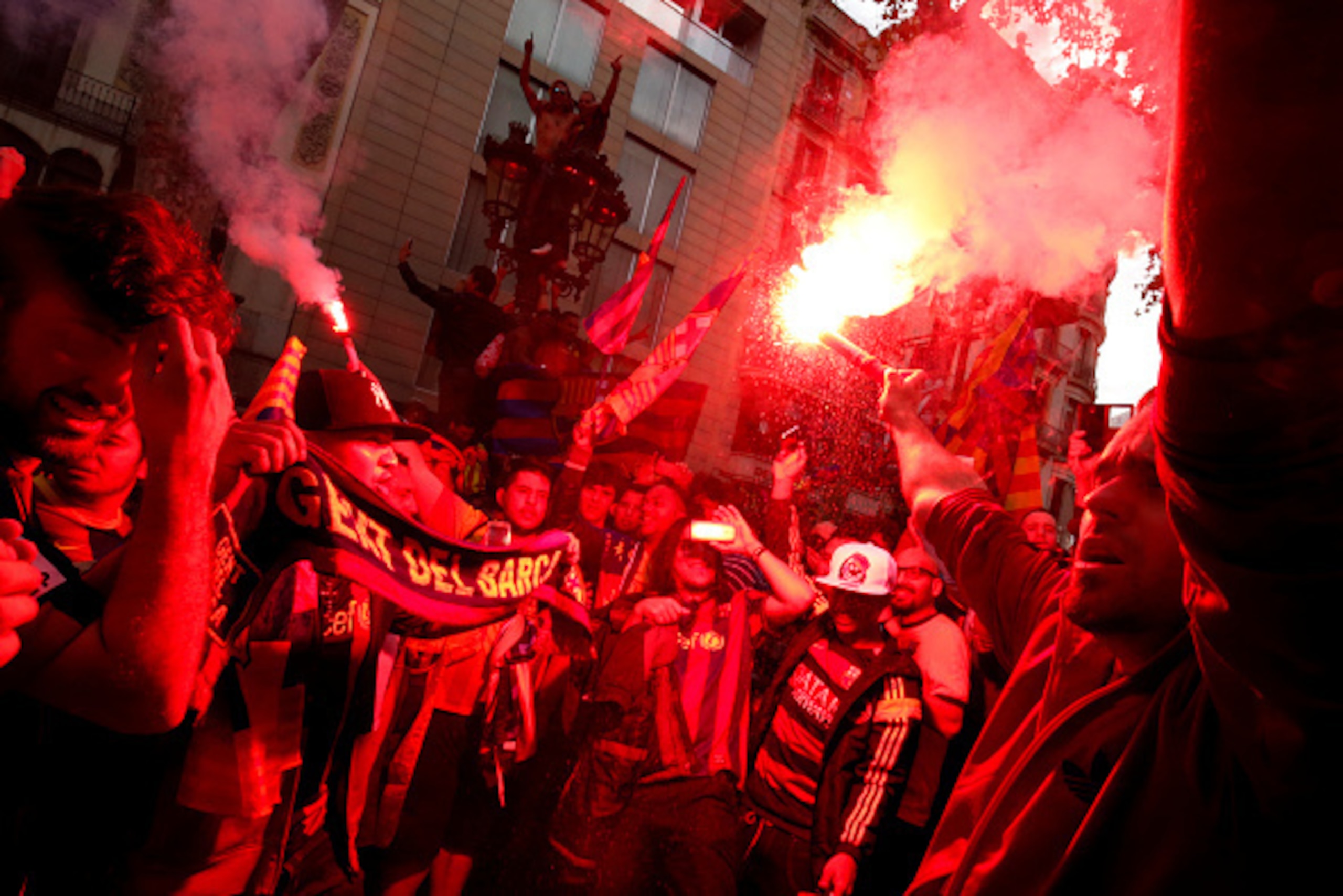 FC Barcelona's supporters celebrate with flares their team's 24th La Liga title at the Canaletes fountain on Las Ramblas in Barcelona, on May 14, 2016.
Barcelona sealed their 24th La Liga title as Luis Suarez took his tally for the season to 59 goals with