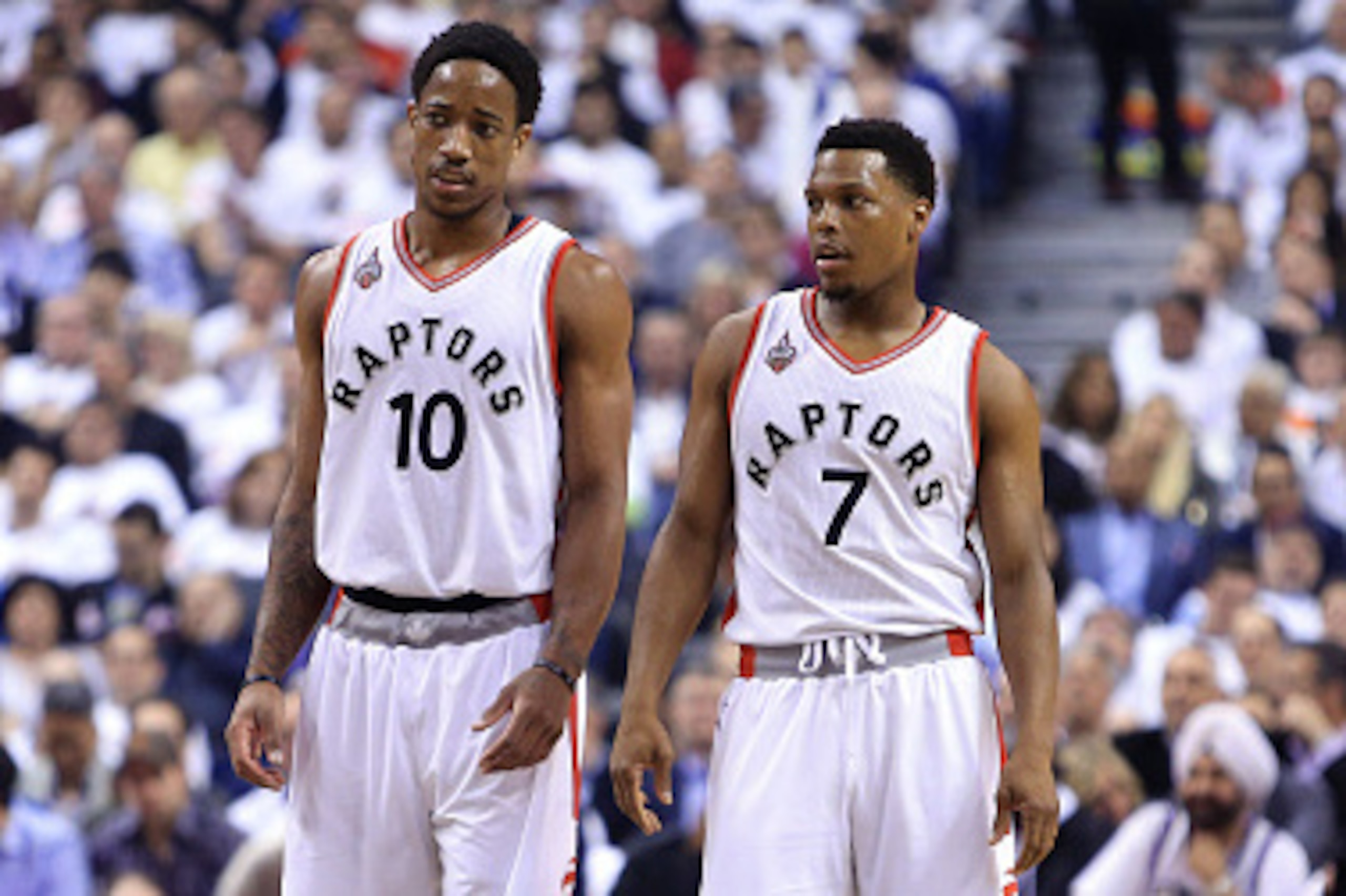 TORONTO, ON - MAY 11:  DeMar DeRozan #10 and Kyle Lowry #7 of the Toronto Raptors talk in the first half of Game Five of the Eastern Conference Semifinals against the Miami Heat during the 2016 NBA Playoffs at the Air Canada Centre on May 11, 2016 in Toro