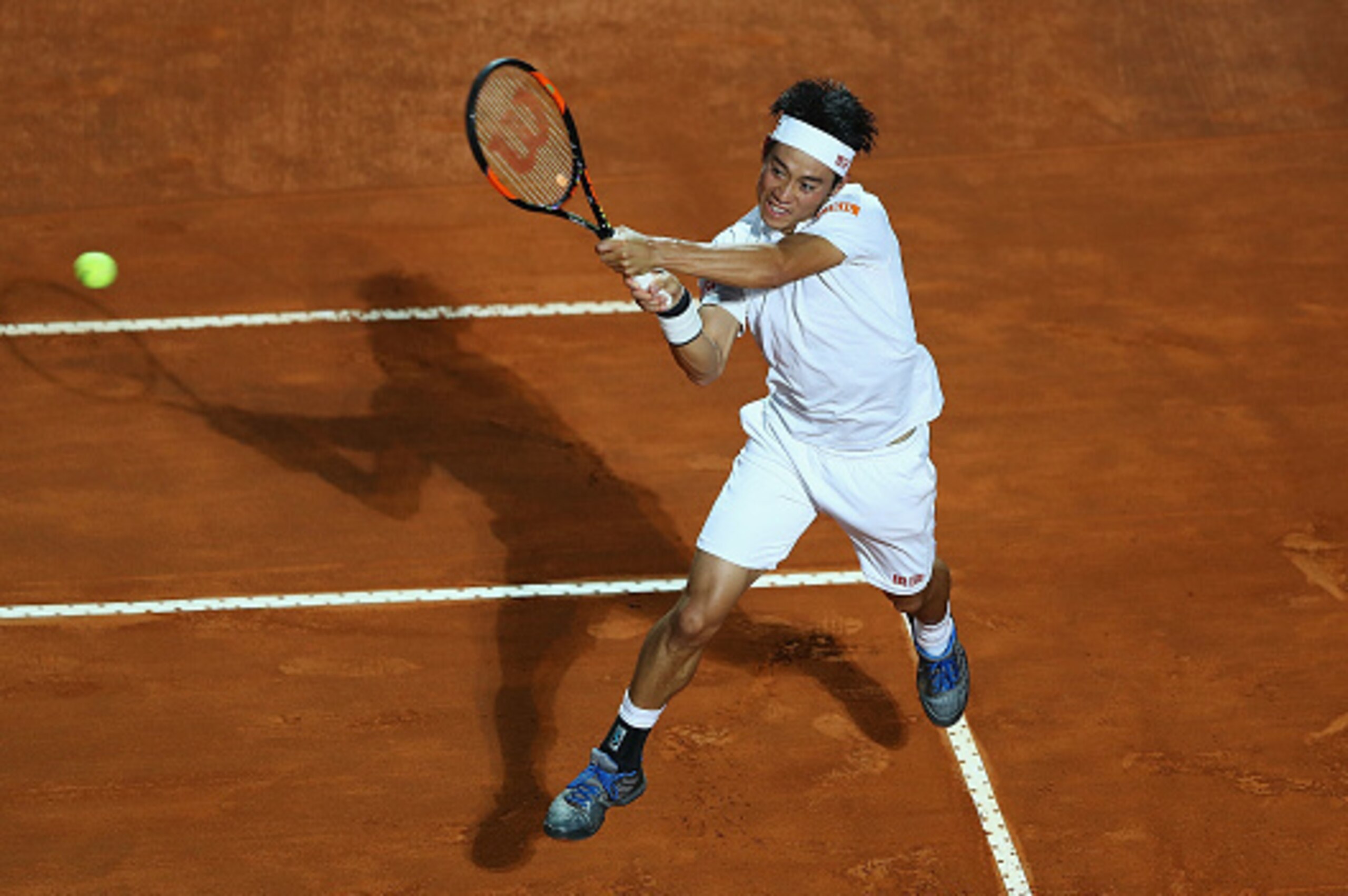 ROME, ITALY - MAY 14:  Kei Nishikori of Japan in action against Novak Djokovic of Serbia during day seven of The Internazionali BNL d'Italia 2016 on May 14, 2016 in Rome, Italy.  (Photo by Matthew Lewis/Getty Images)
