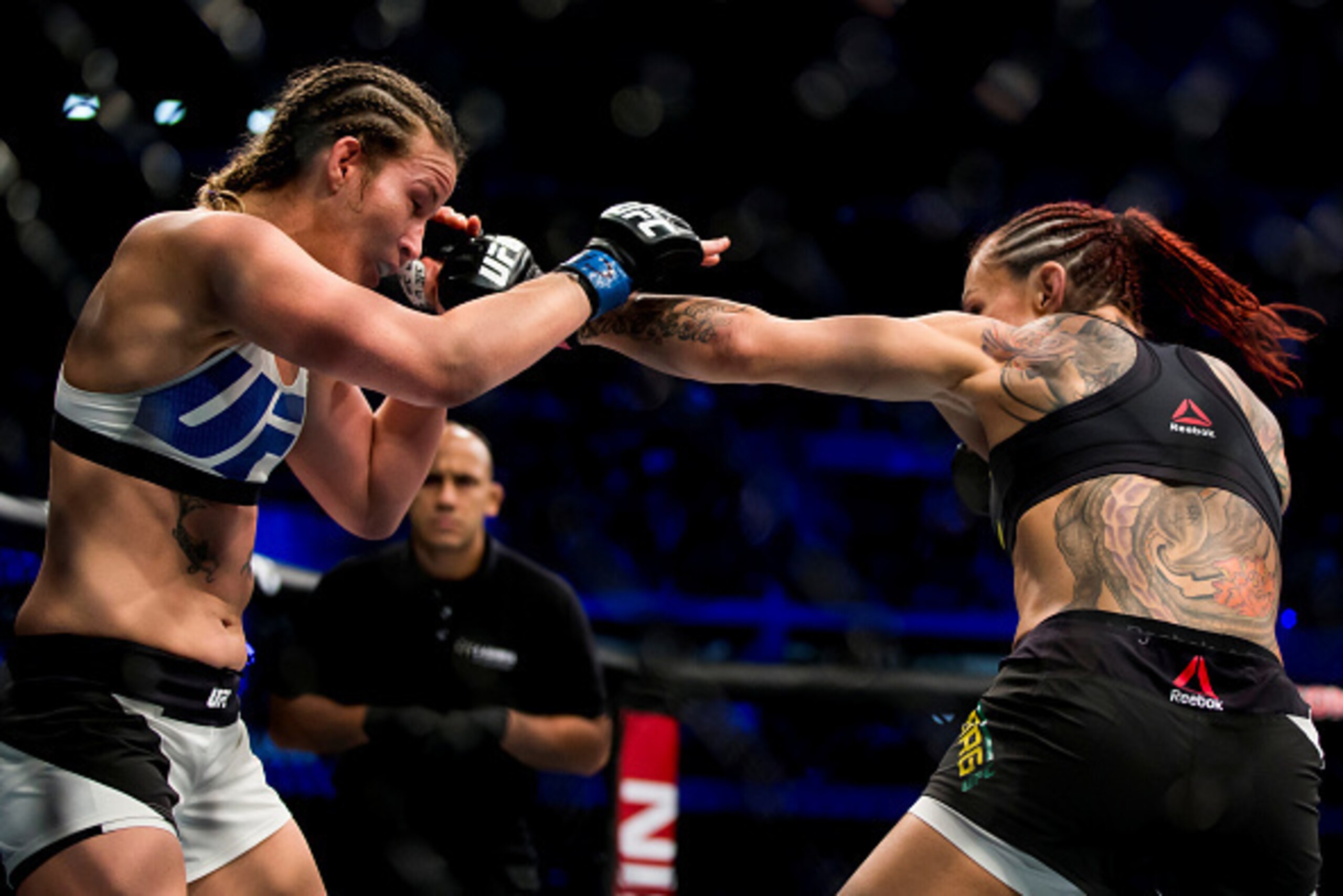 CURITIBA, BRAZIL - MAY 14: Cris 'Cyborg' Justino of Brazil punches Leslie Smith of the United States in their catchweight bout during the UFC 198 at Arena da Baixada stadium on May 14, 2016 in Curitiba, Brazil. (Photo by Buda Mendes/Zuffa LLC/Zuffa LLC vi